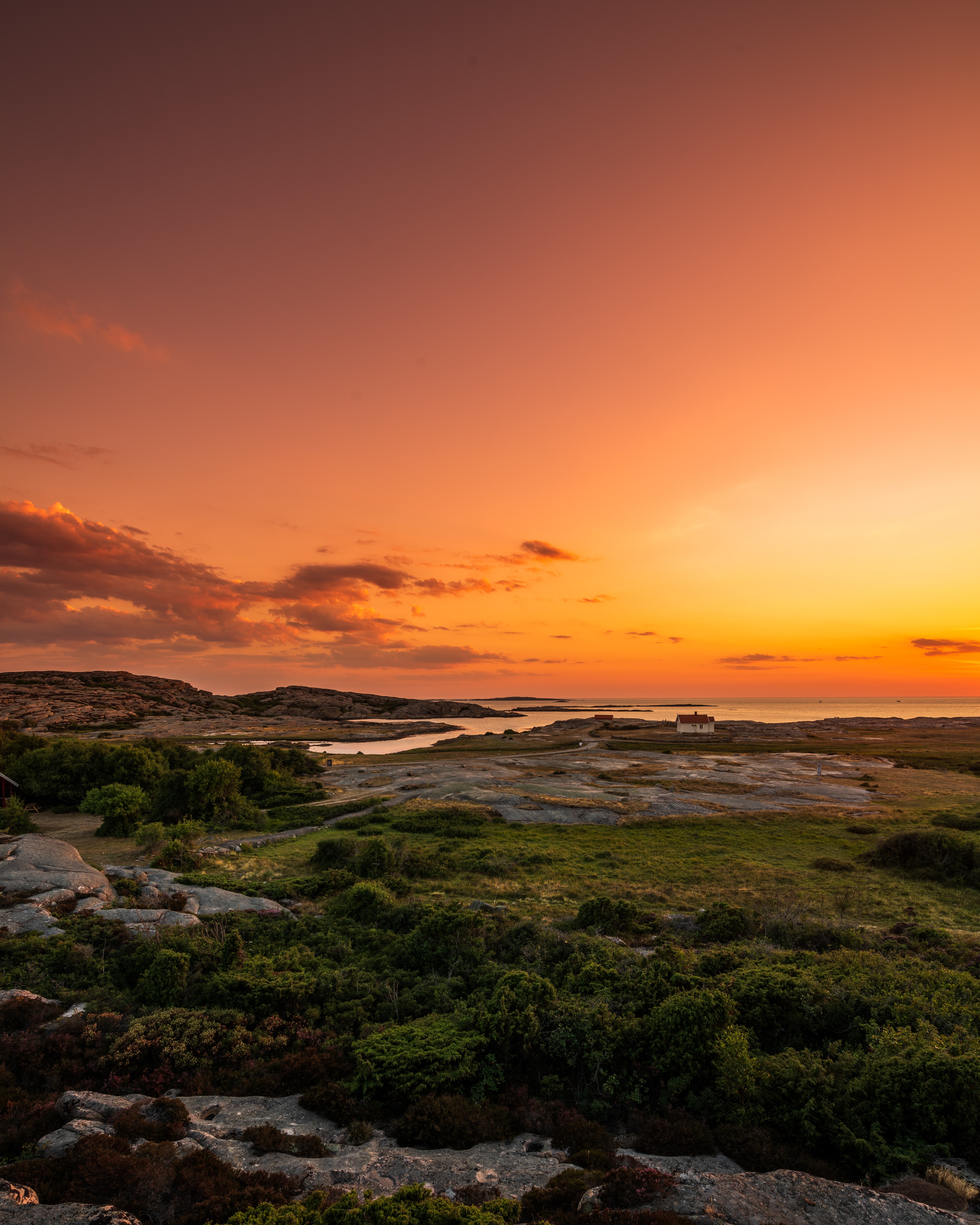 Coastal landscape at sunset with orange sky HD Phone Wallpaper