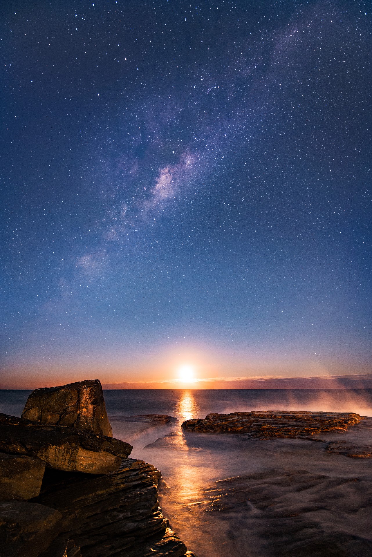 Milky Way over the ocean at sunset with rocks HD Phone Wallpaper