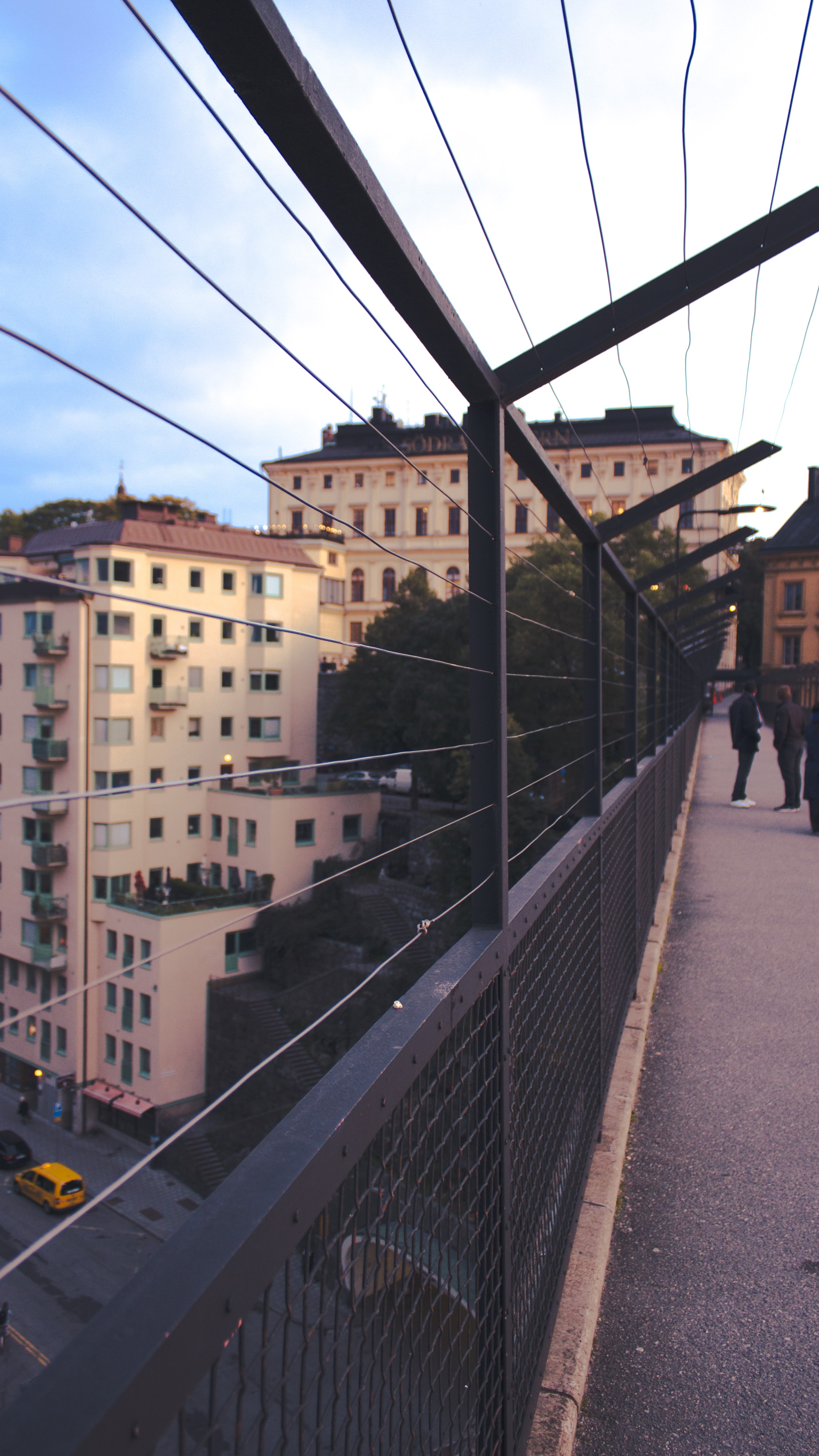 Buildings and a bridge railing in Stockholm, Sweden HD Phone Wallpaper