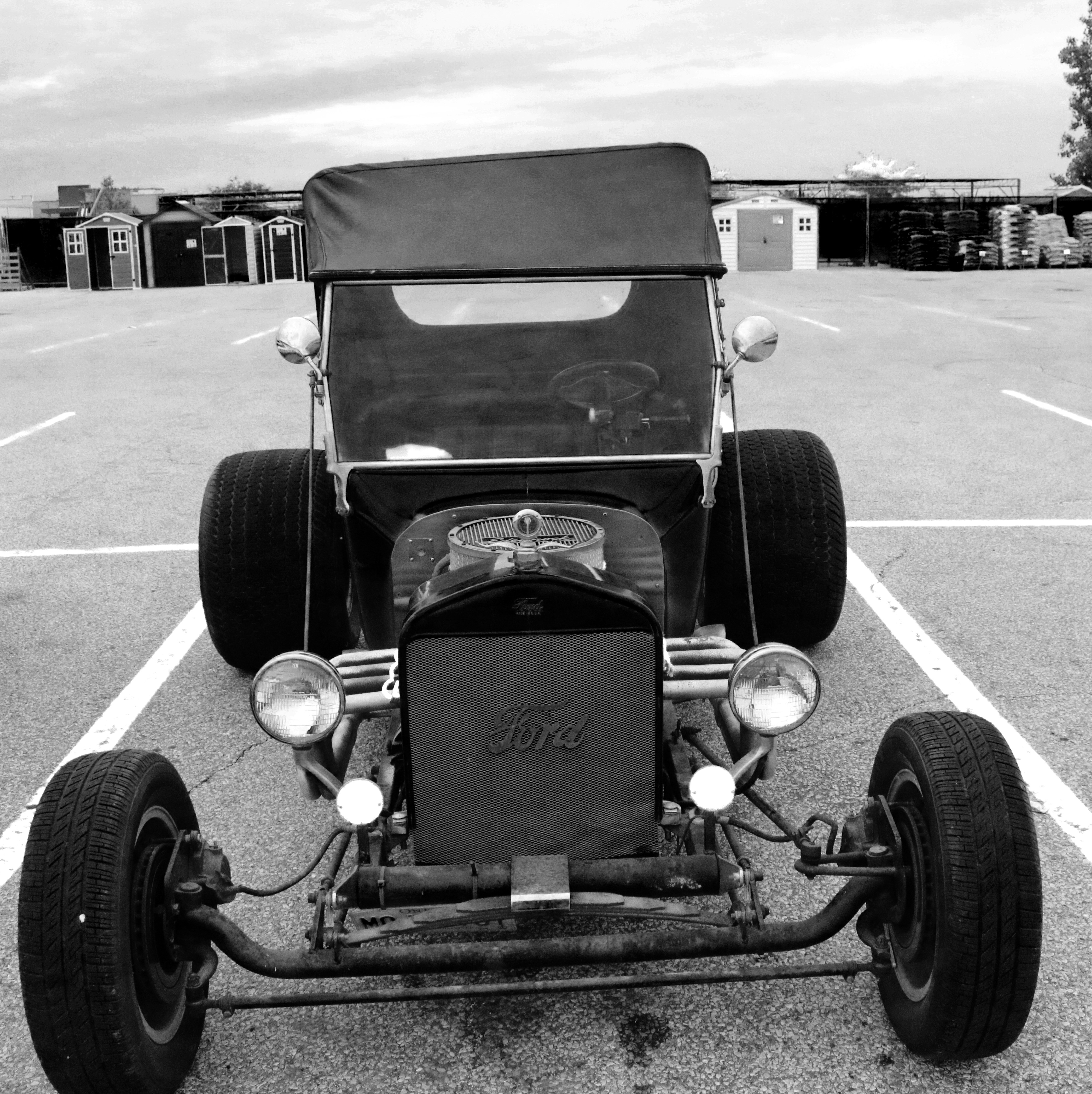 Black and white Ford Rat Rod parked in a lot HD Phone Wallpaper