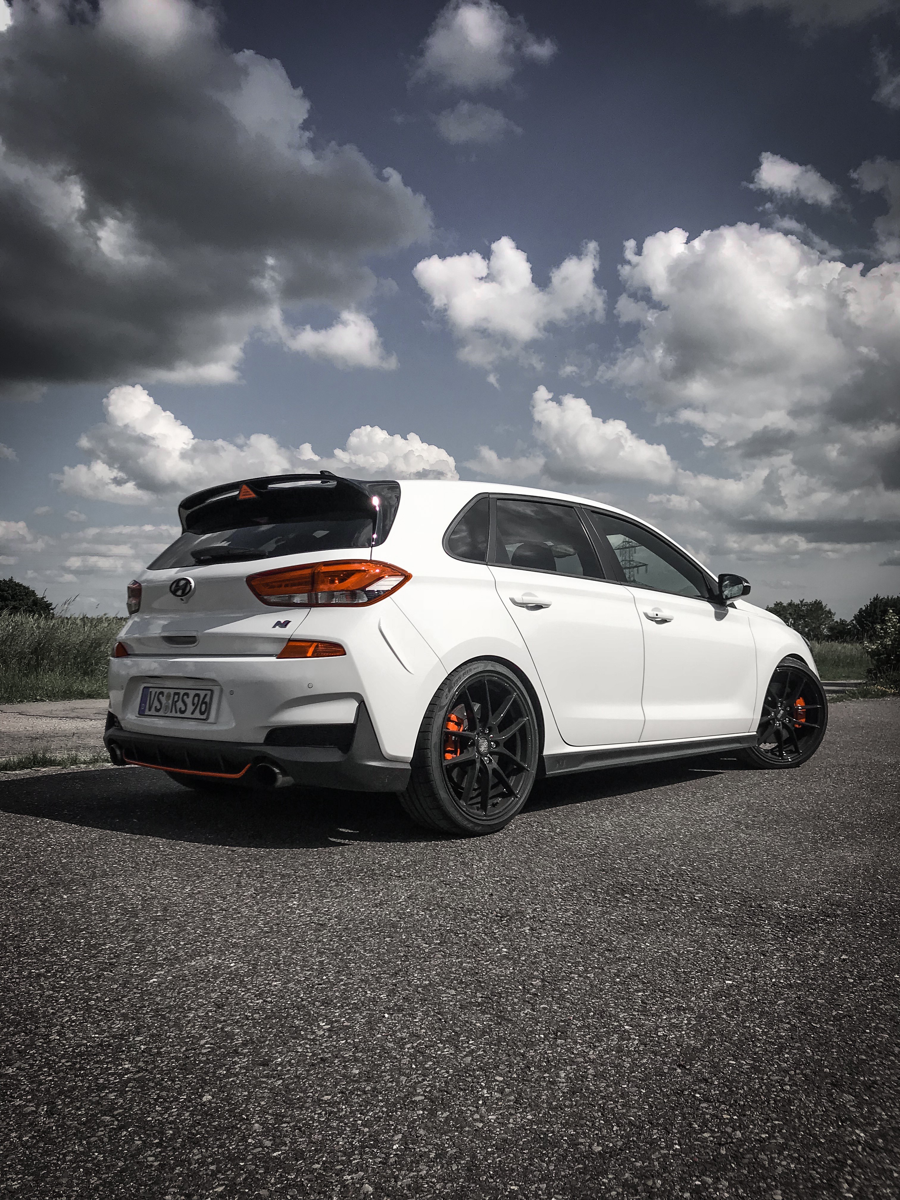 White Hyundai i30N Hatchback on Asphalt Road HD Phone Wallpaper