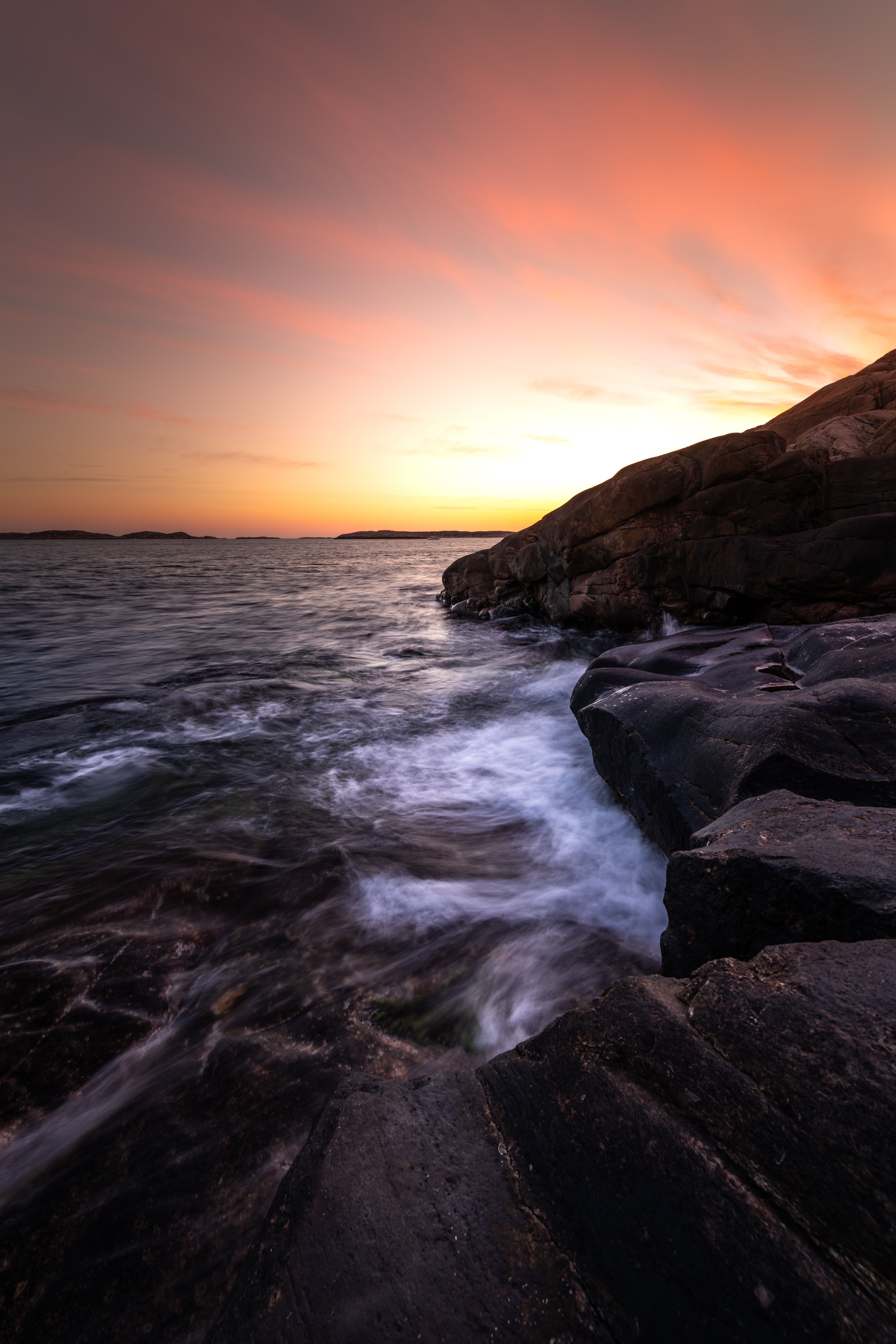 Ocean waves crashing on rocks at sunset HD Phone Wallpaper