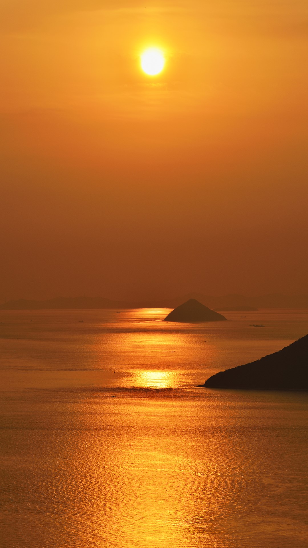 Sunset over the sea with islands and reflections HD Phone Wallpaper