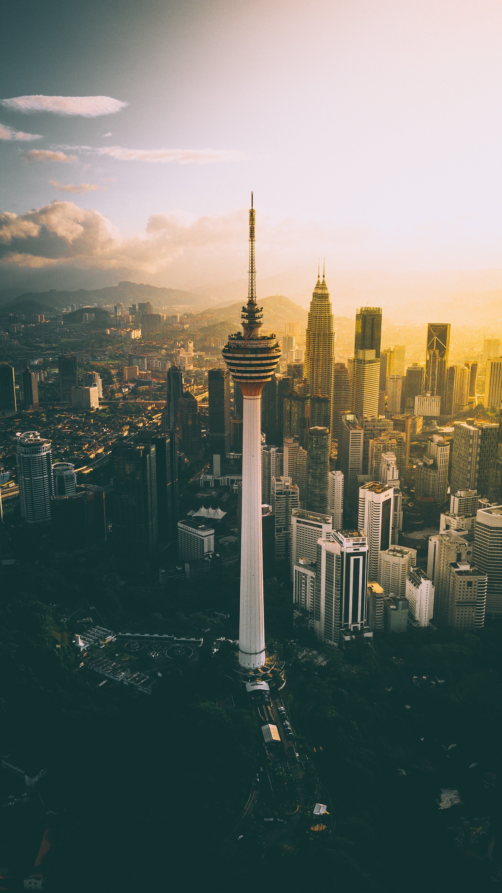 Aerial view of Kuala Lumpur cityscape with Menara KL tower HD Phone Wallpaper