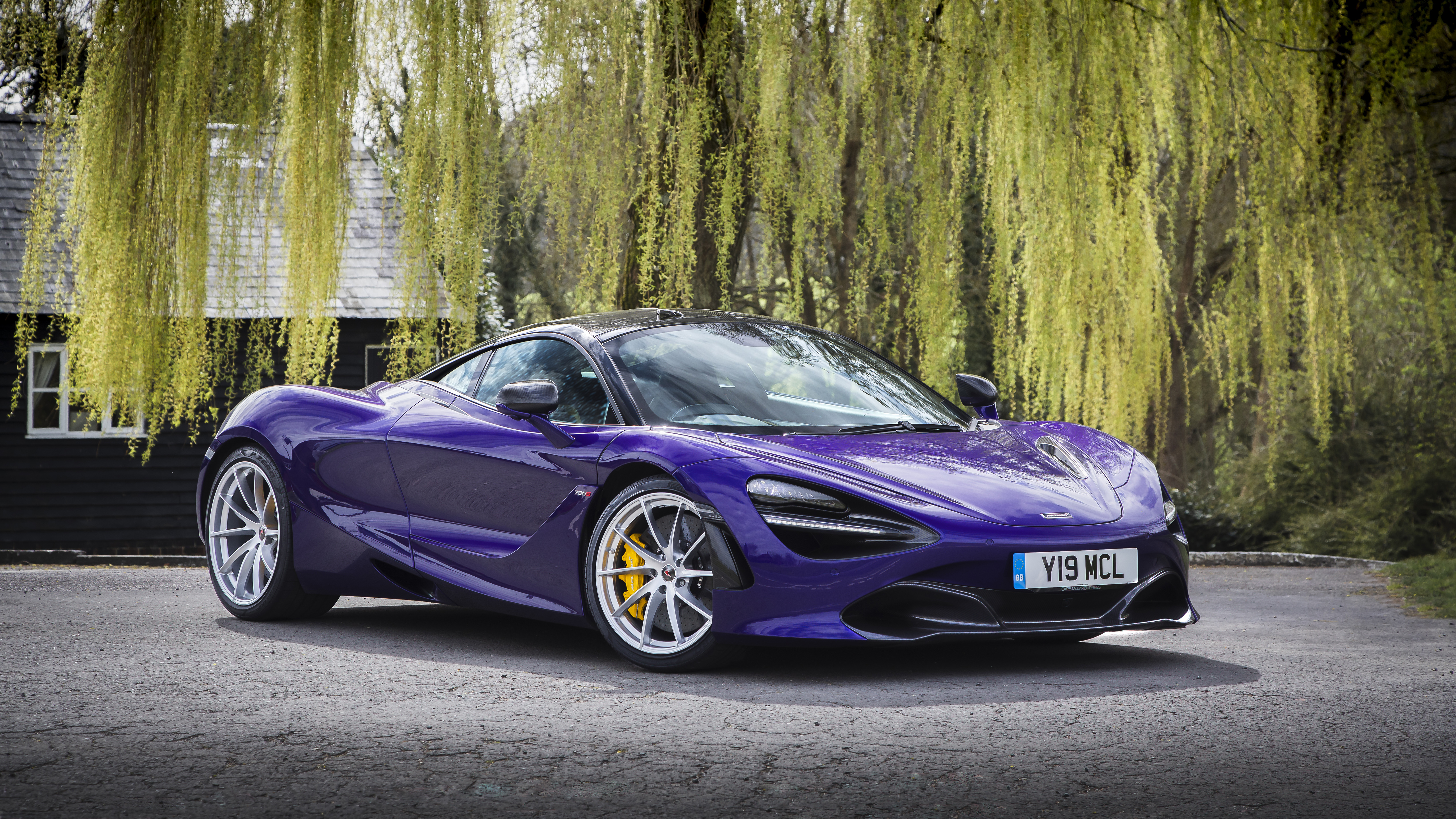 Purple McLaren 720S parked near a house HD Wallpaper