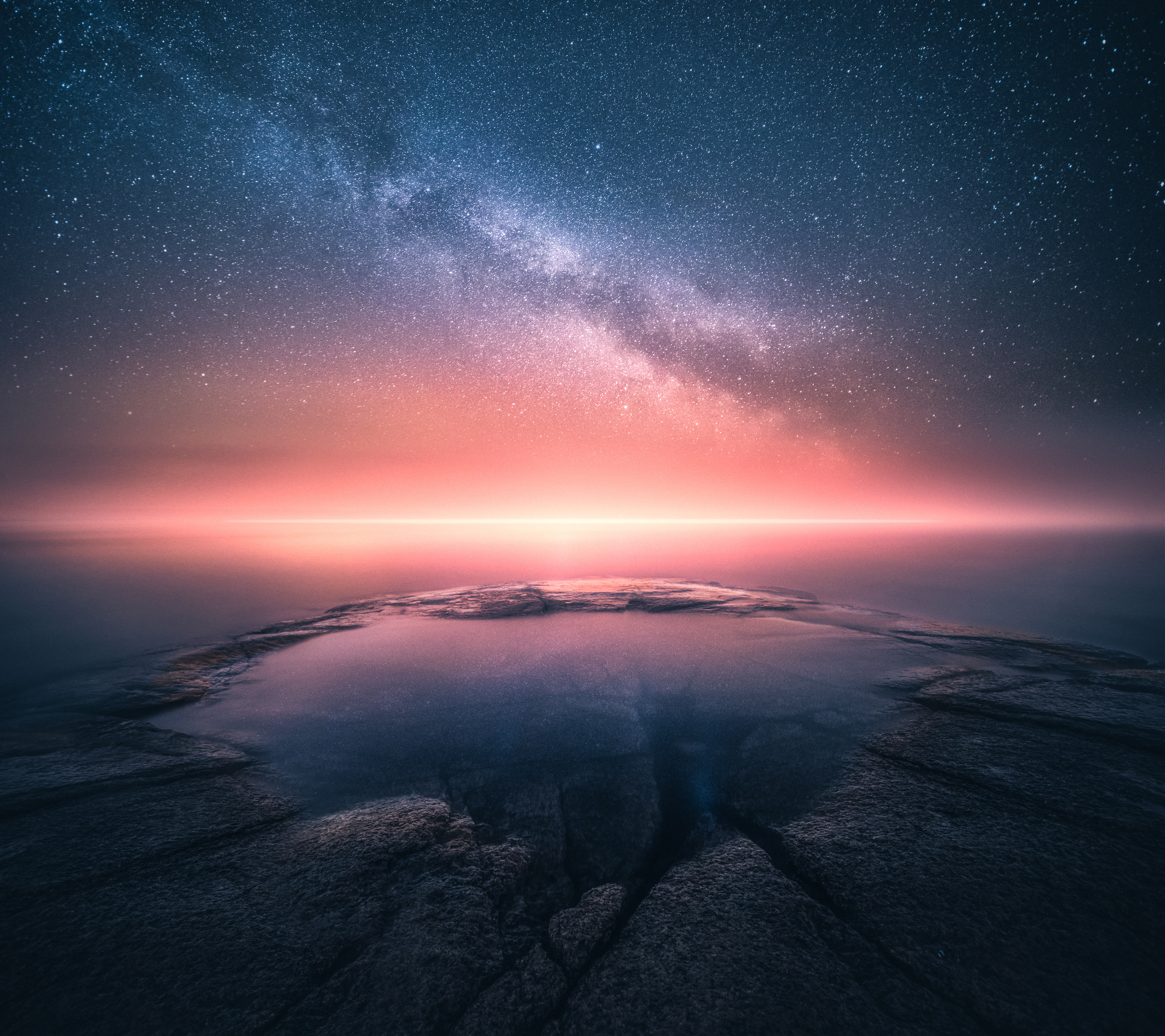 Starry sky over a rocky shore at sunset HD Wallpaper