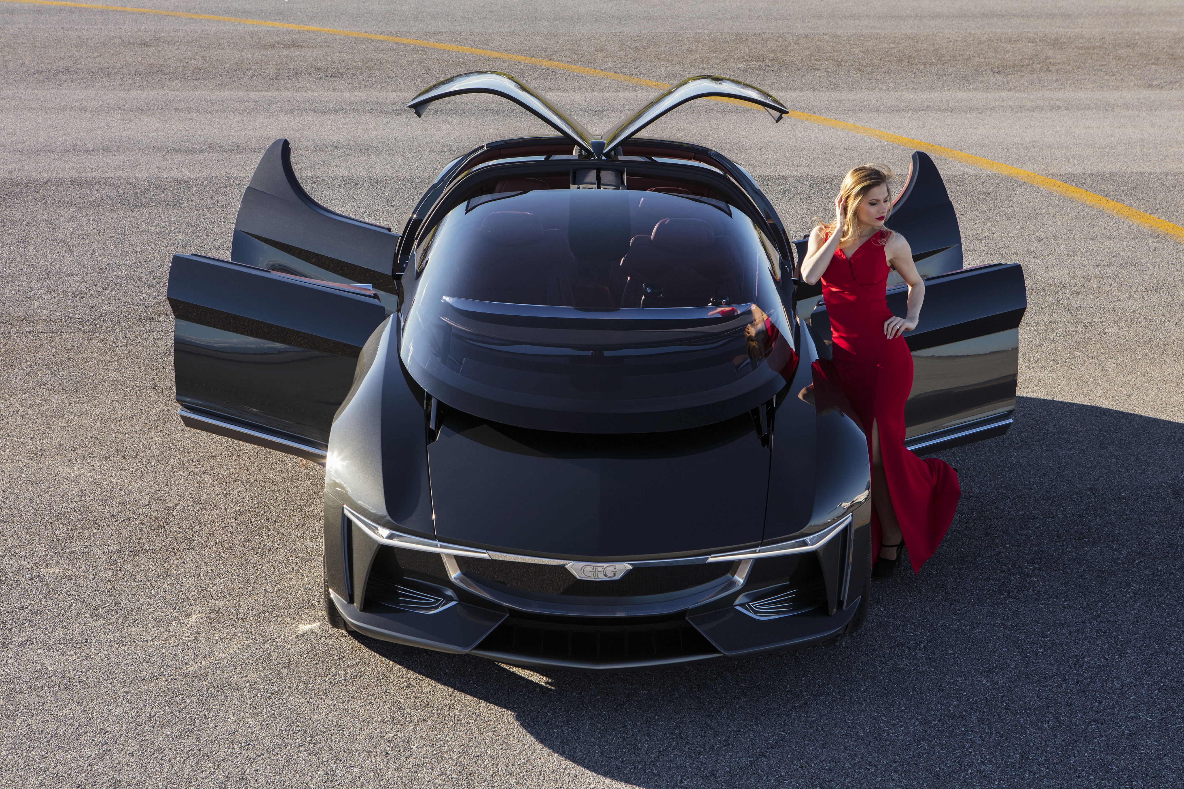 GFG Sibylla Electric Sedan with Woman in Red Dress HD Wallpaper