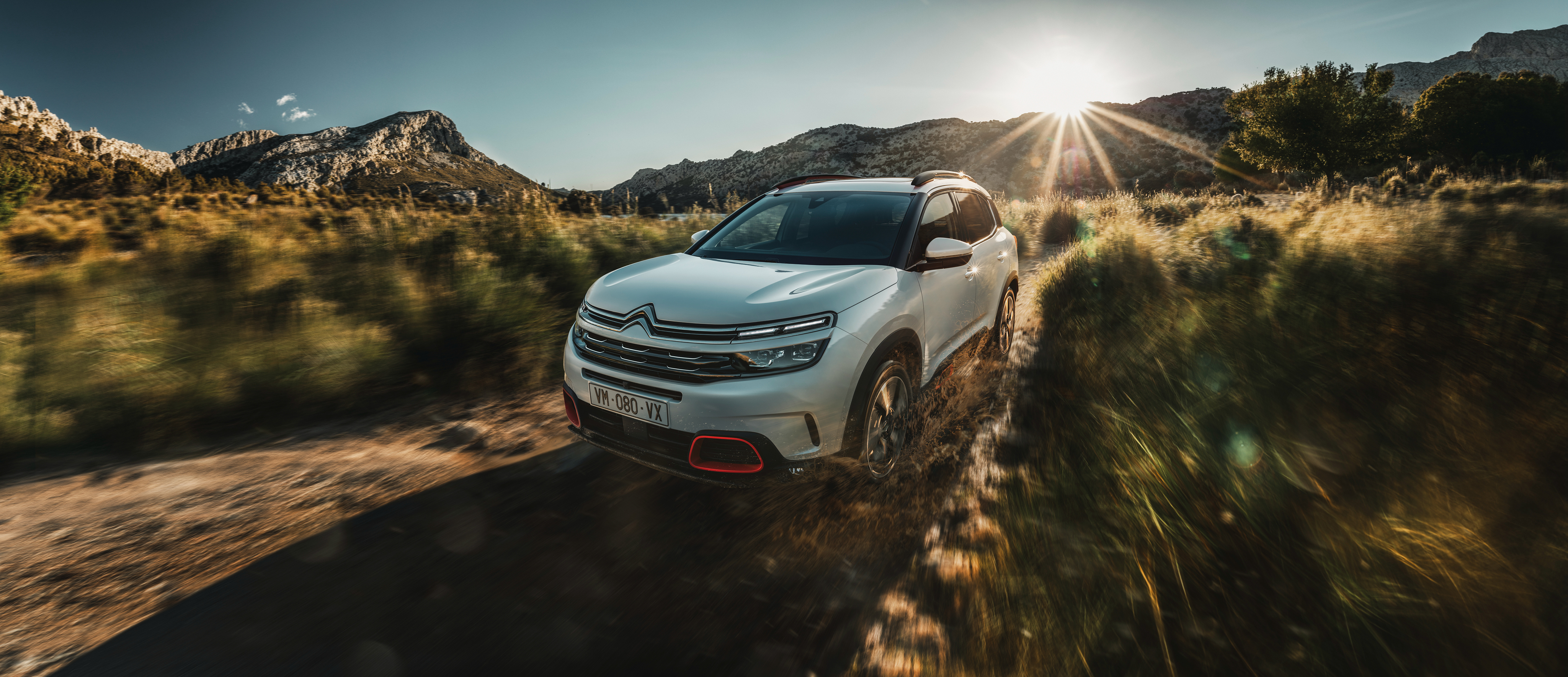White Citroen C5 Aircross driving on a dirt road HD Wallpaper