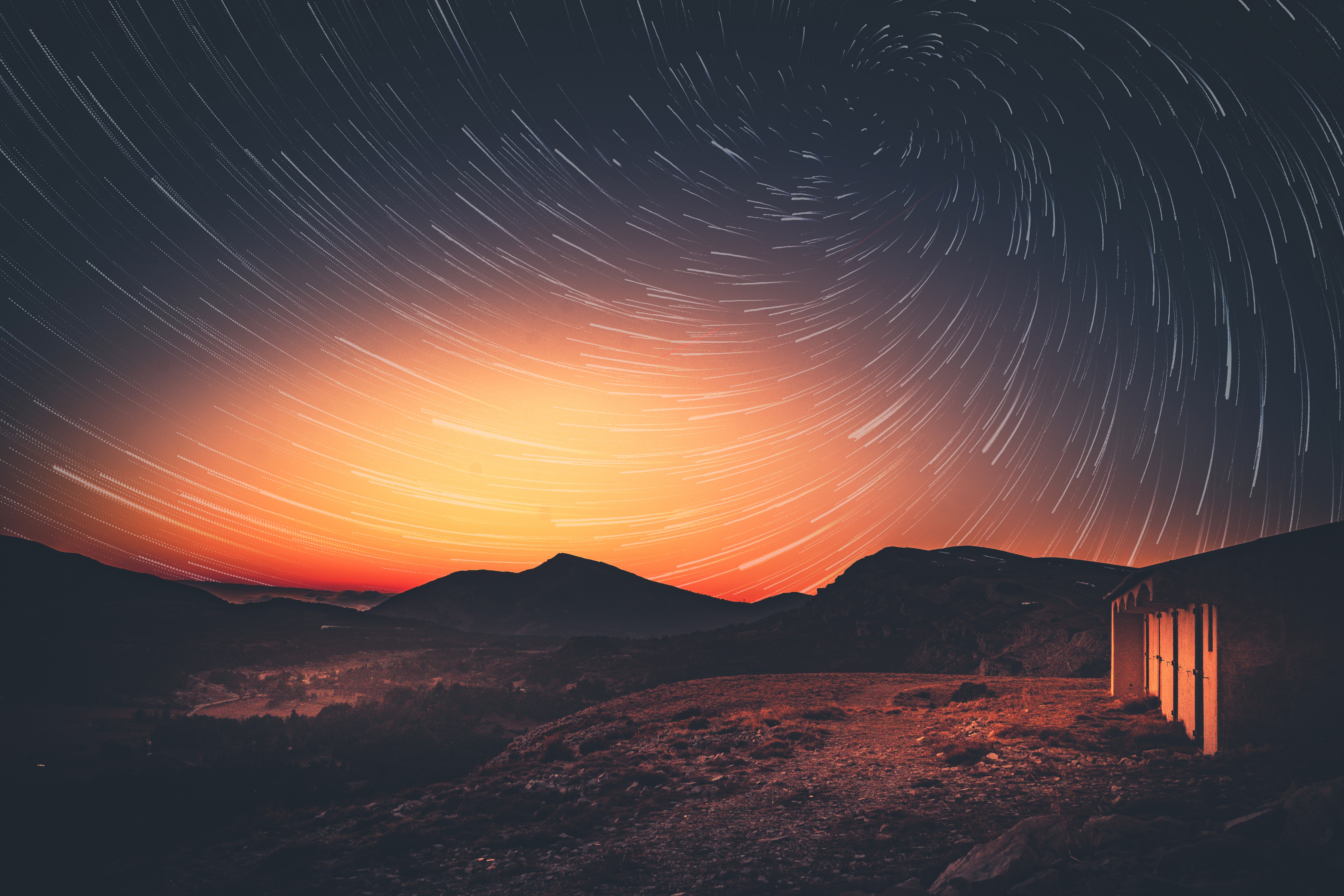 Star trails over mountains at dusk HD Wallpaper