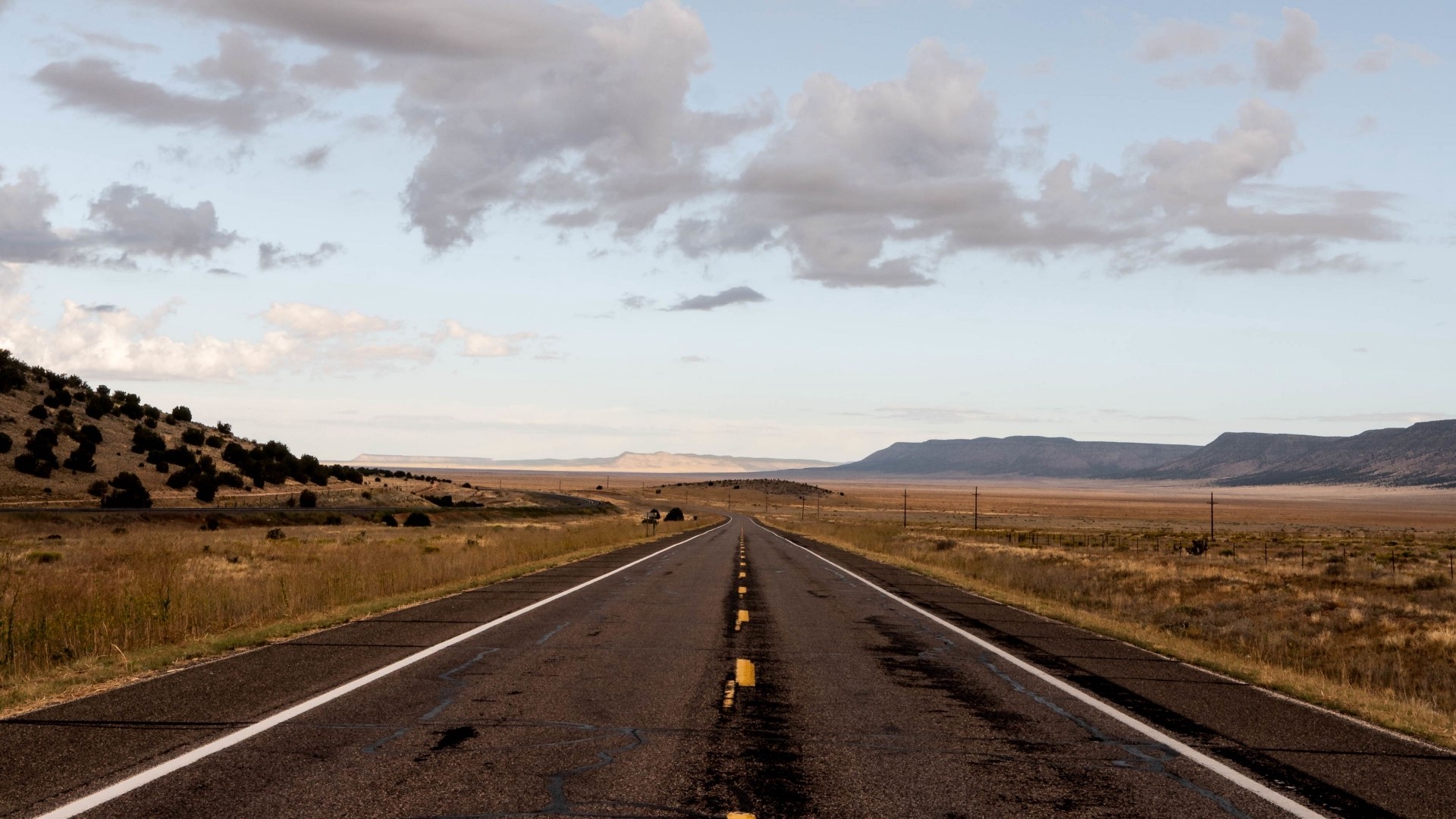 Desert Highway with Mountains and Clouds HD Wallpaper