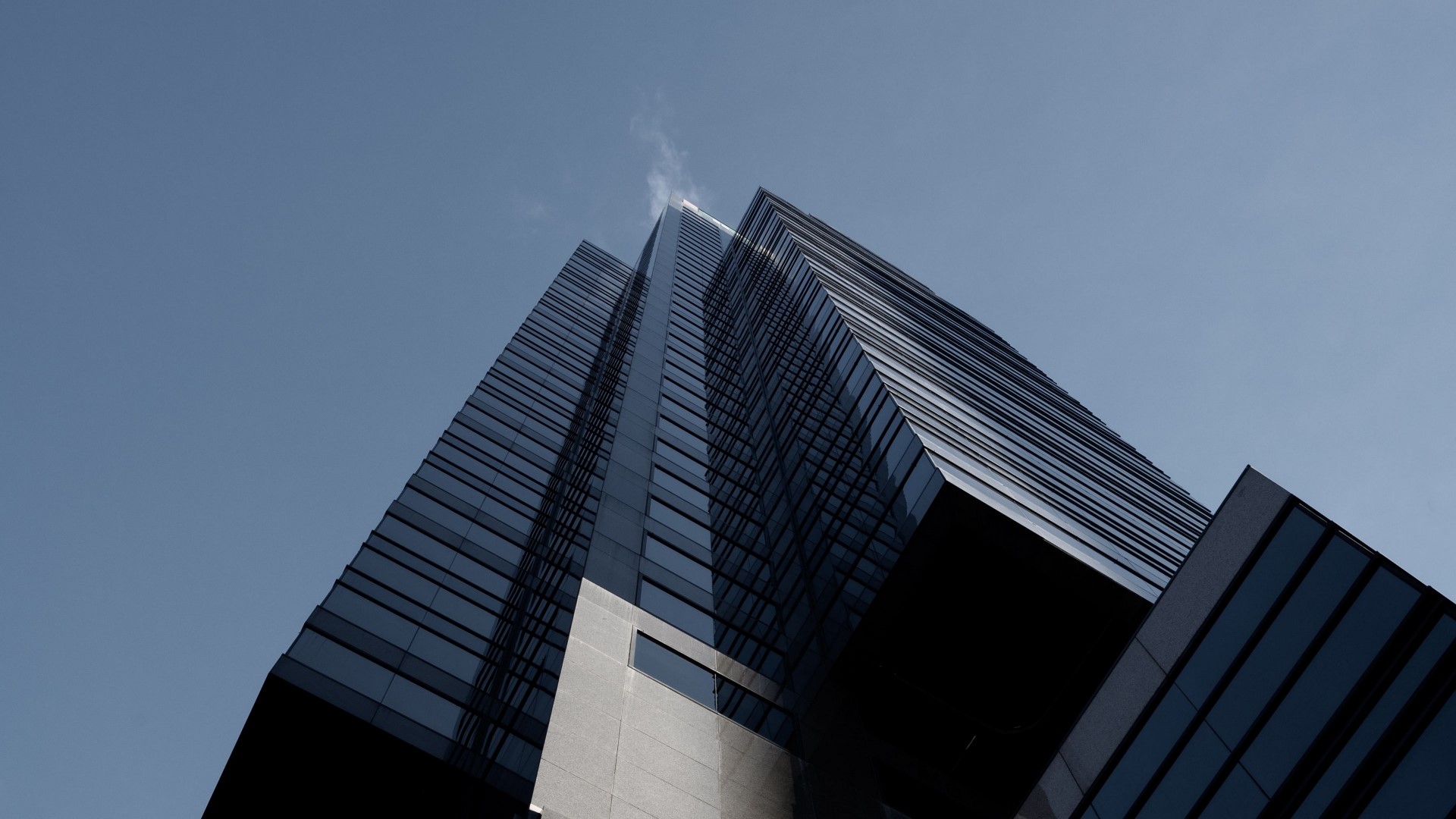 Skyscraper against a clear blue sky HD Wallpaper