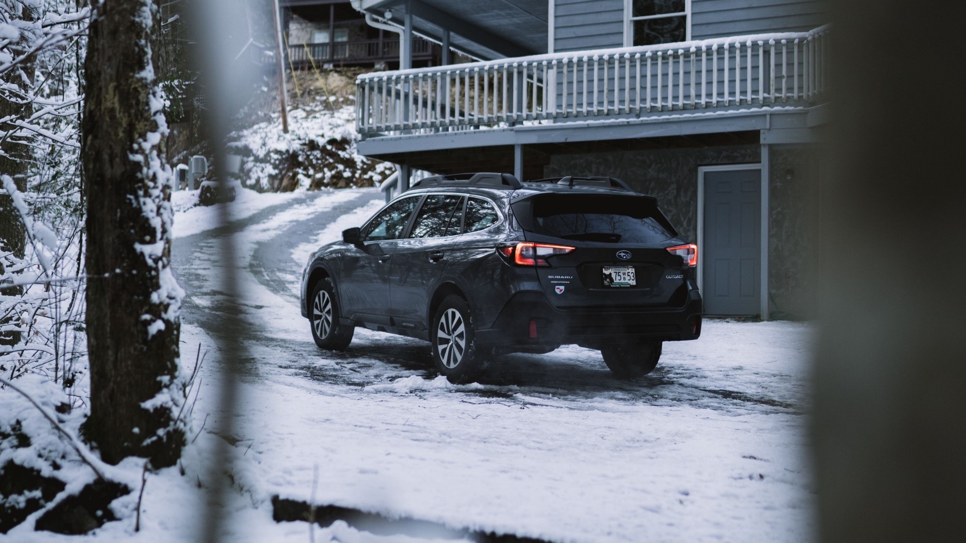 Subaru Outback on a Snowy Driveway HD Wallpaper