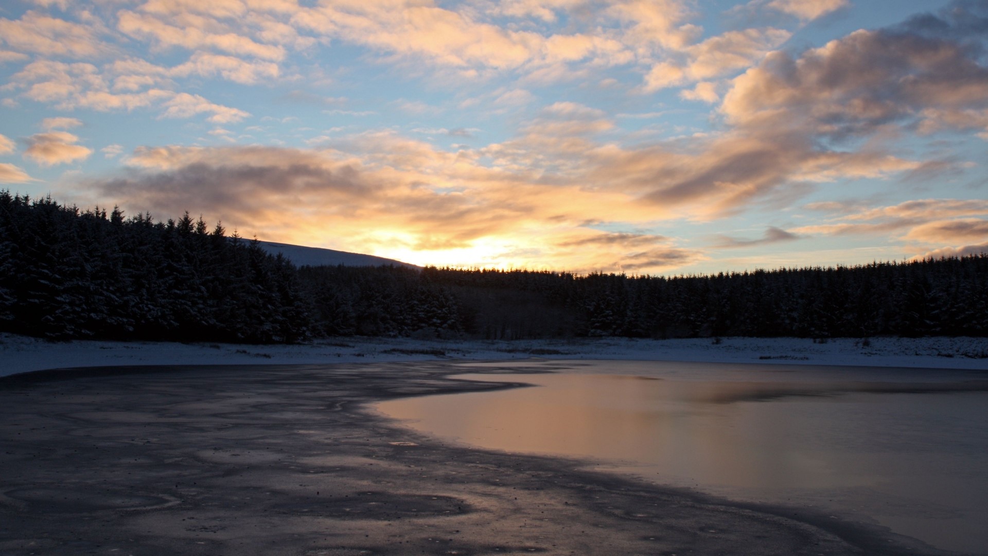 Frozen lake at sunset with pine forest HD Wallpaper