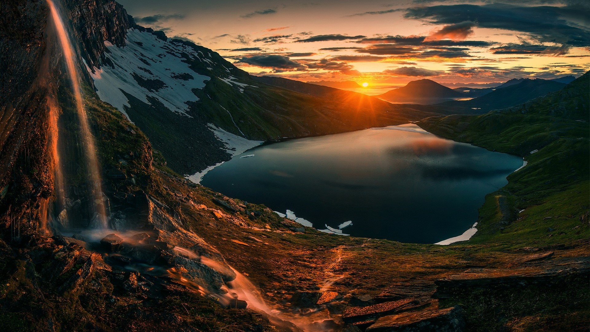 Sunset over a mountain lake with a waterfall HD Wallpaper