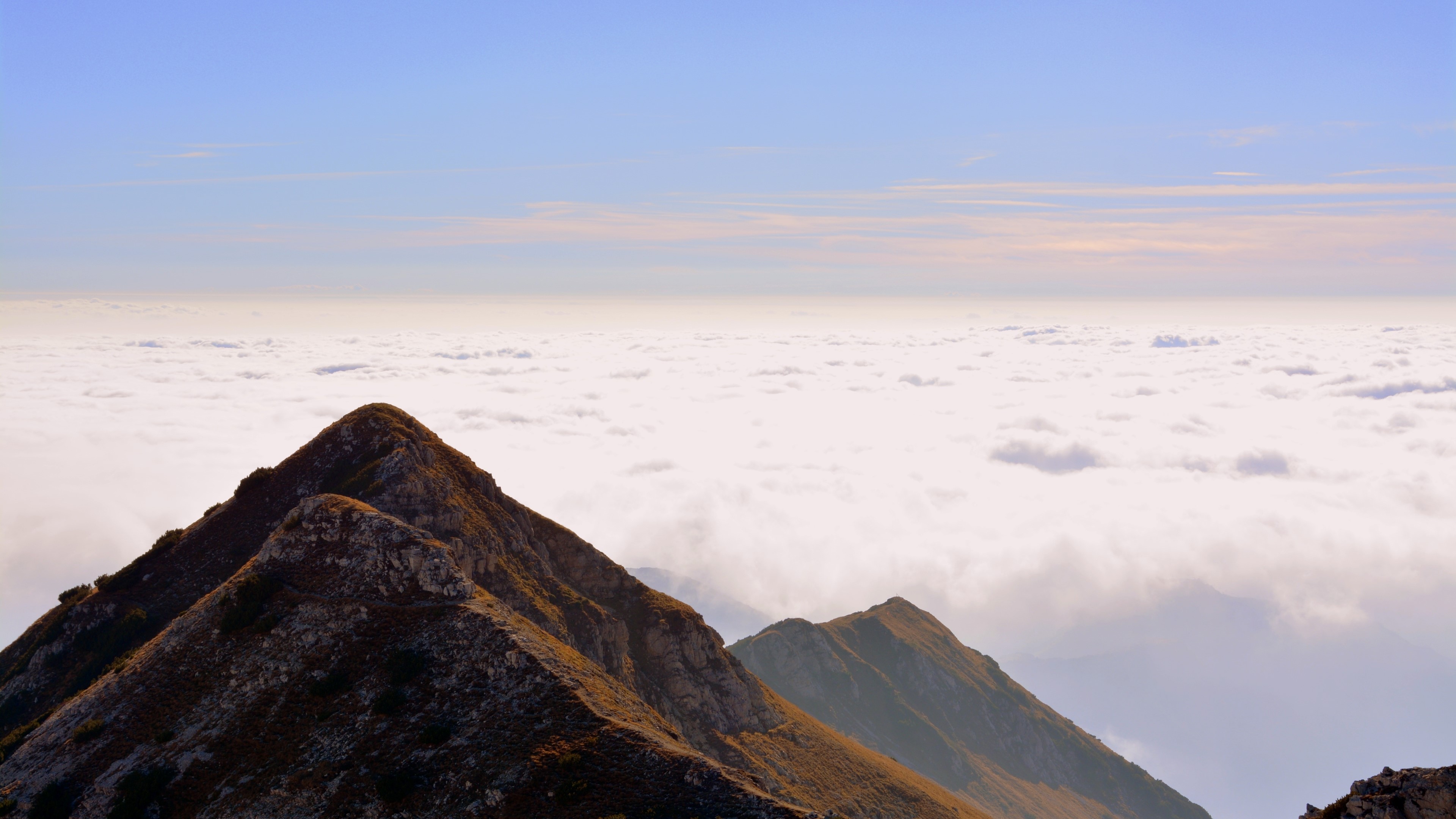 Mountain peaks above clouds in Italy HD Wallpaper