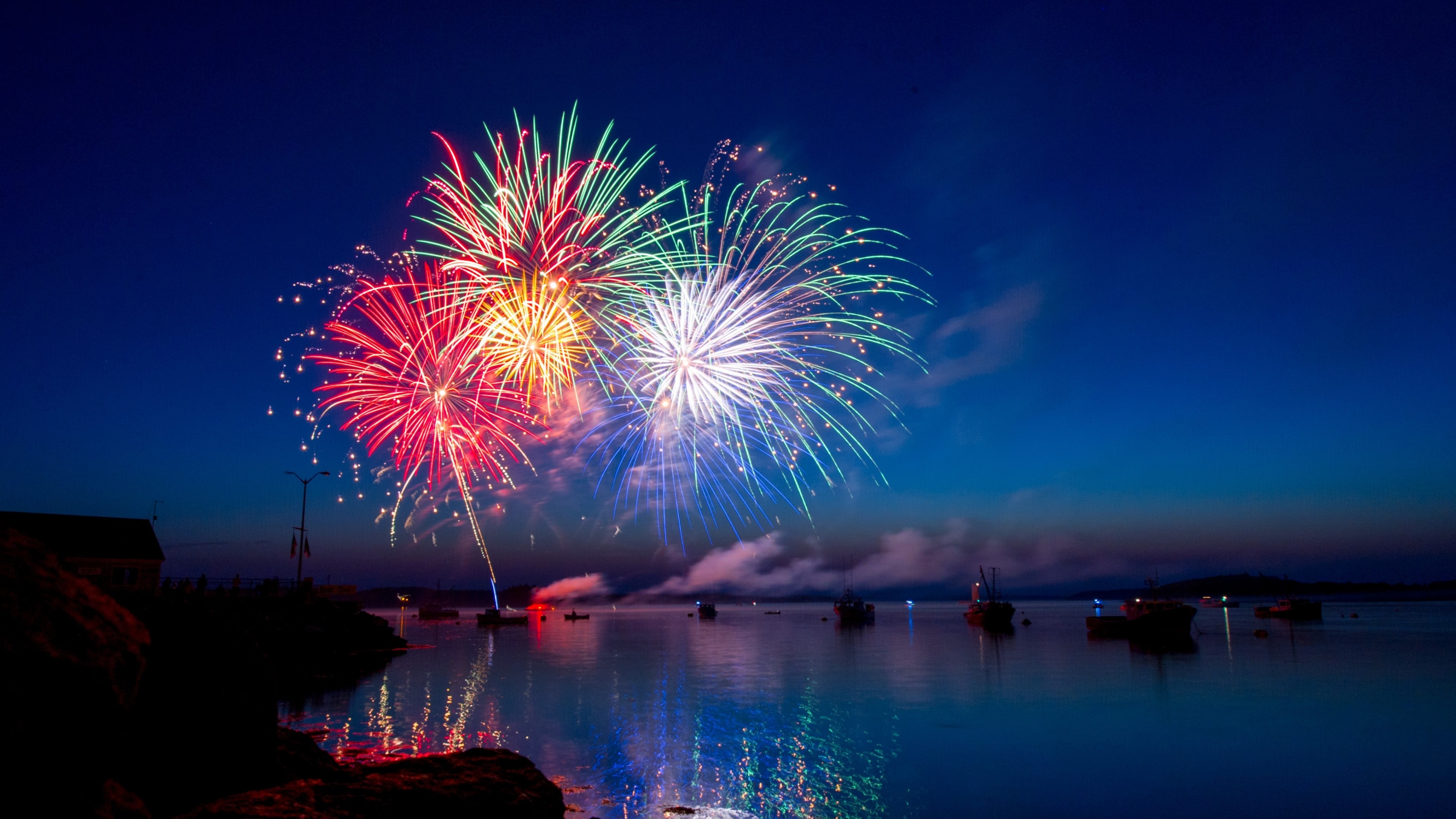 4K Fireworks Over Water at Night HD Wallpaper