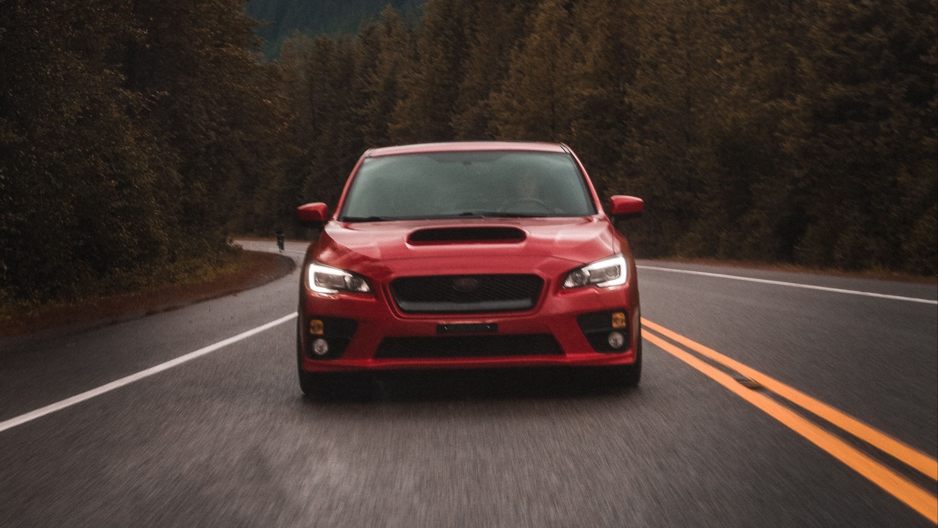 Red Subaru WRX driving on a wet road HD Wallpaper