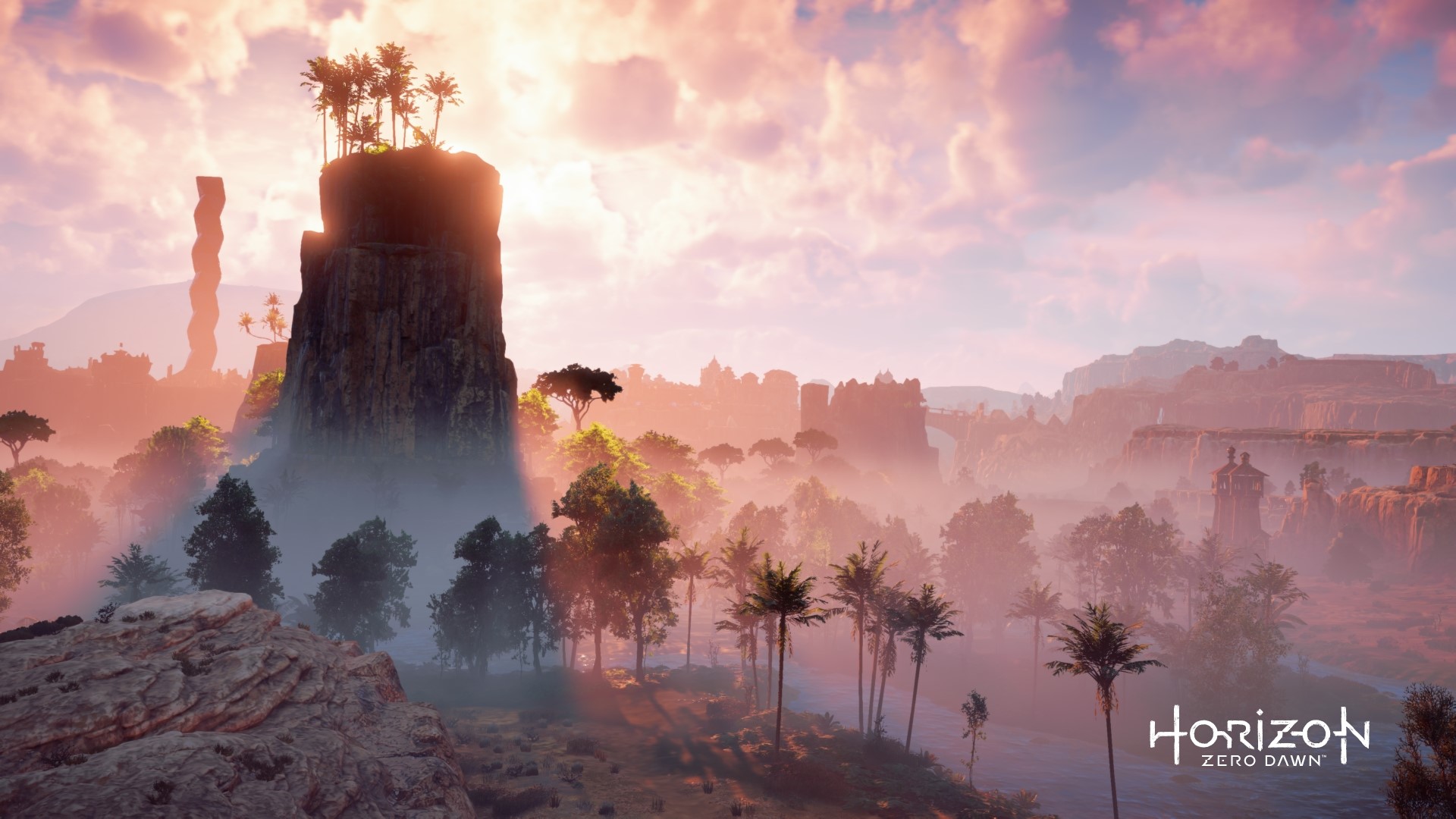 Horizon Zero Dawn landscape with rock formations and trees HD Wallpaper