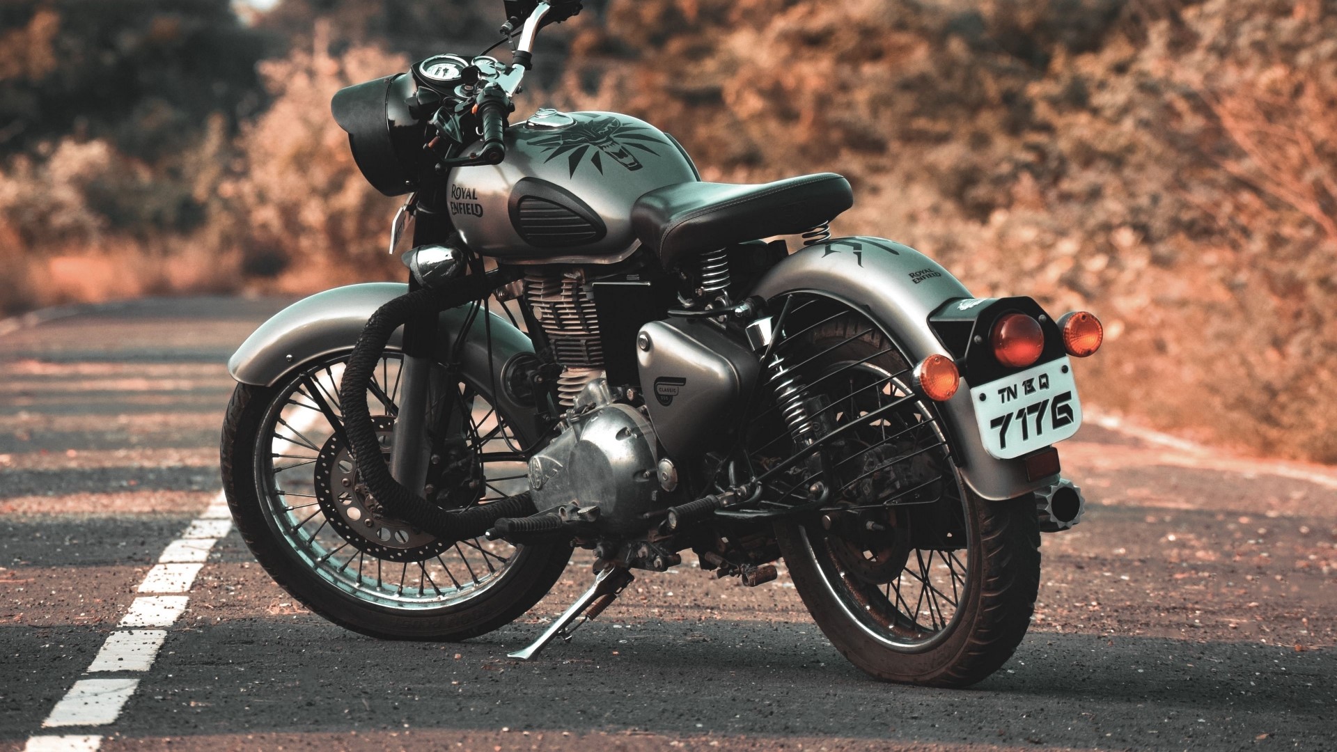 Royal Enfield motorcycle on a road HD Wallpaper
