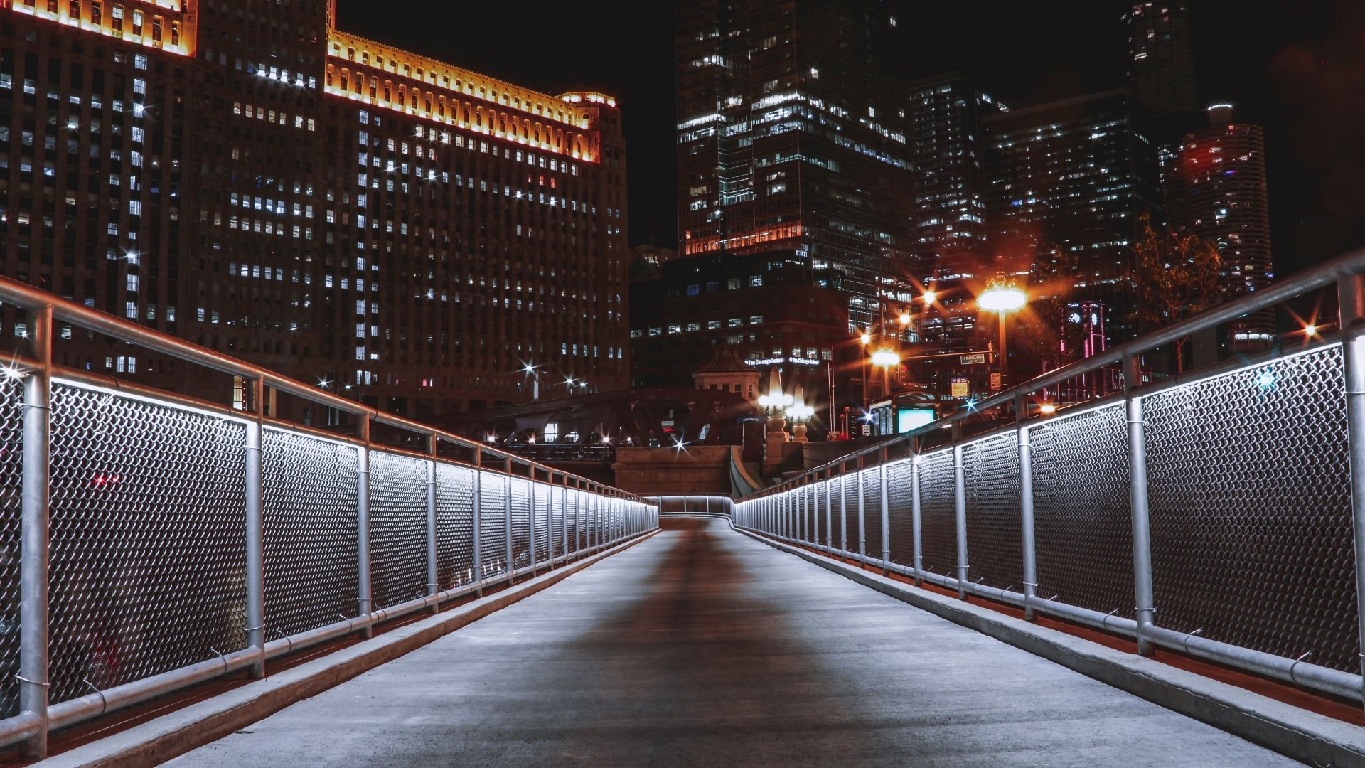 Bridge at night with city buildings HD Wallpaper