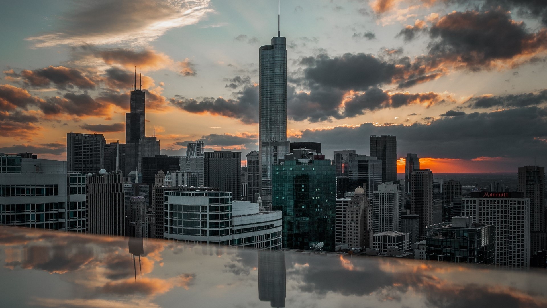 Cityscape with skyscrapers and sunset reflection HD Wallpaper