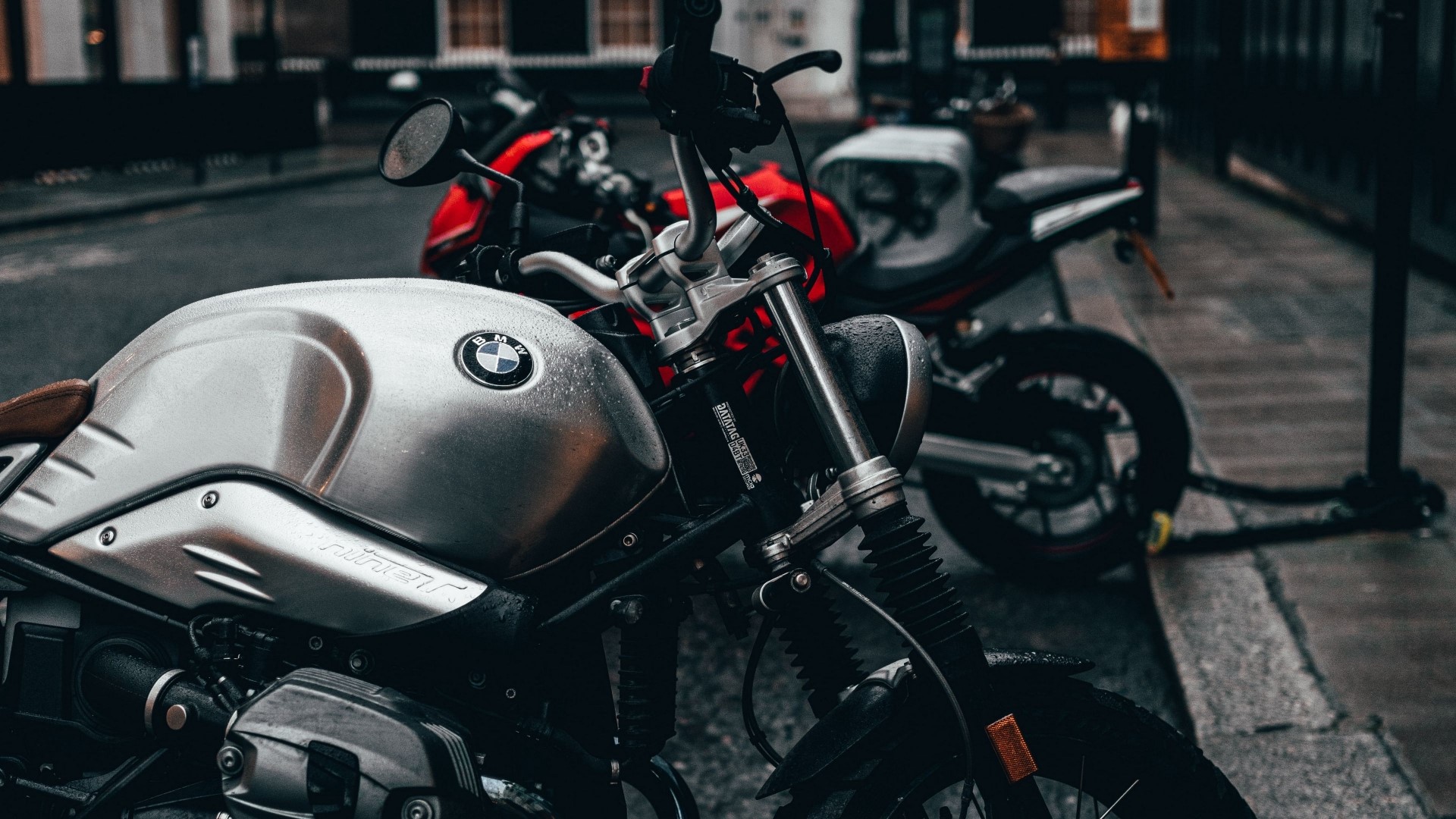 BMW motorcycle parked on a wet street HD Wallpaper