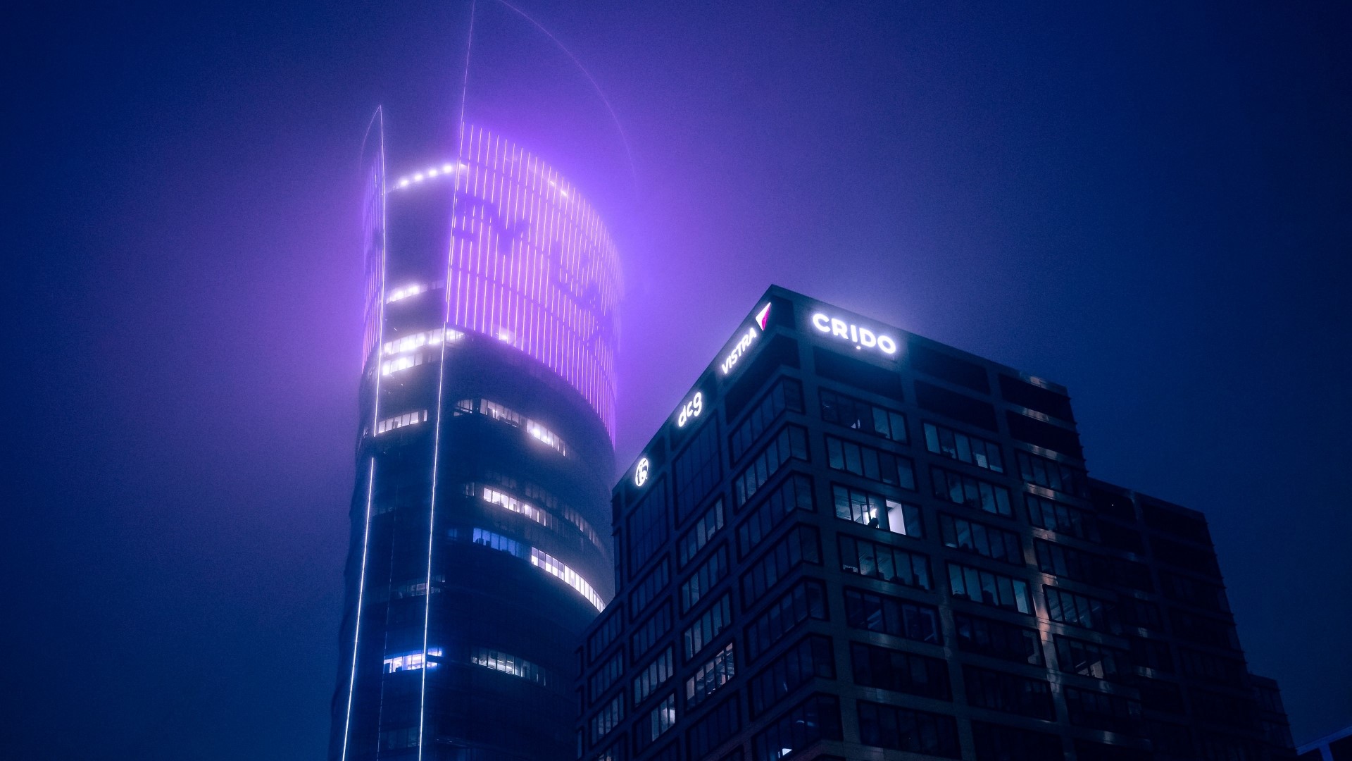 Night city skyscrapers with purple and white lights HD Wallpaper