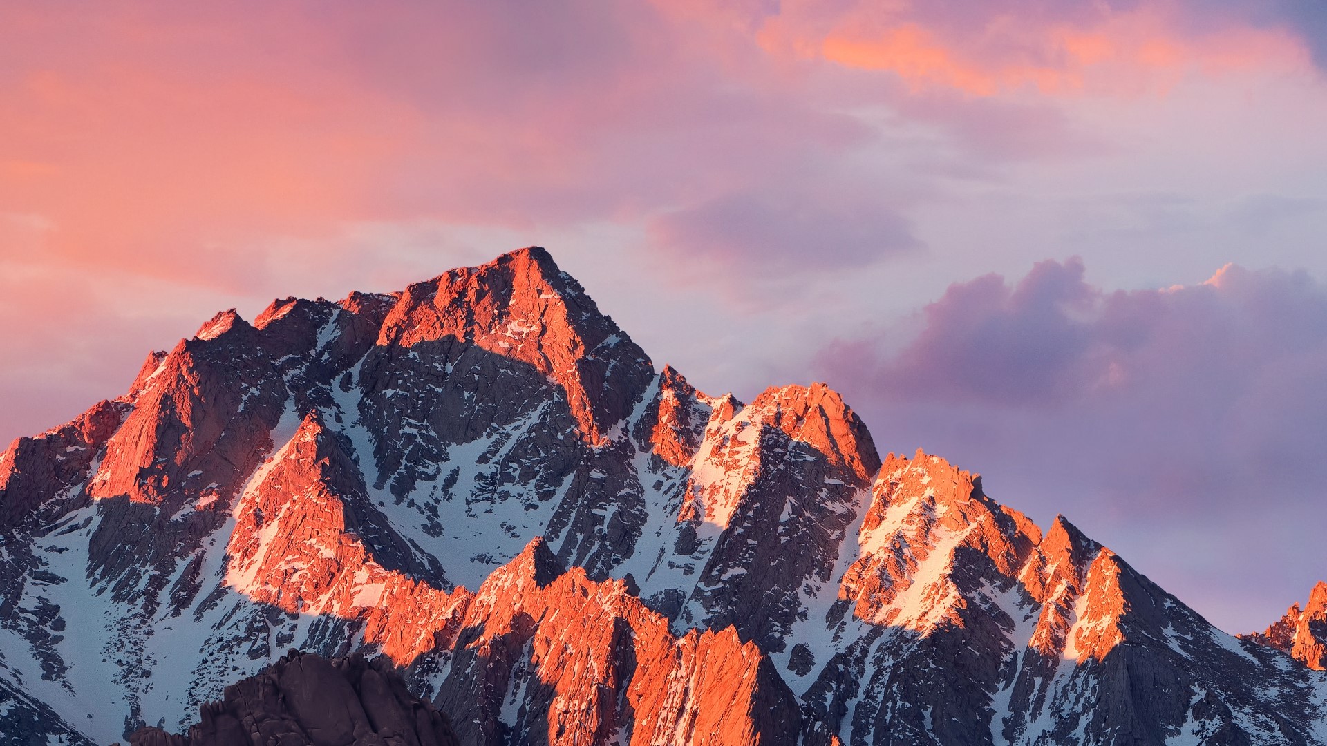 Mountain peaks at dawn with pink and purple sky HD Wallpaper