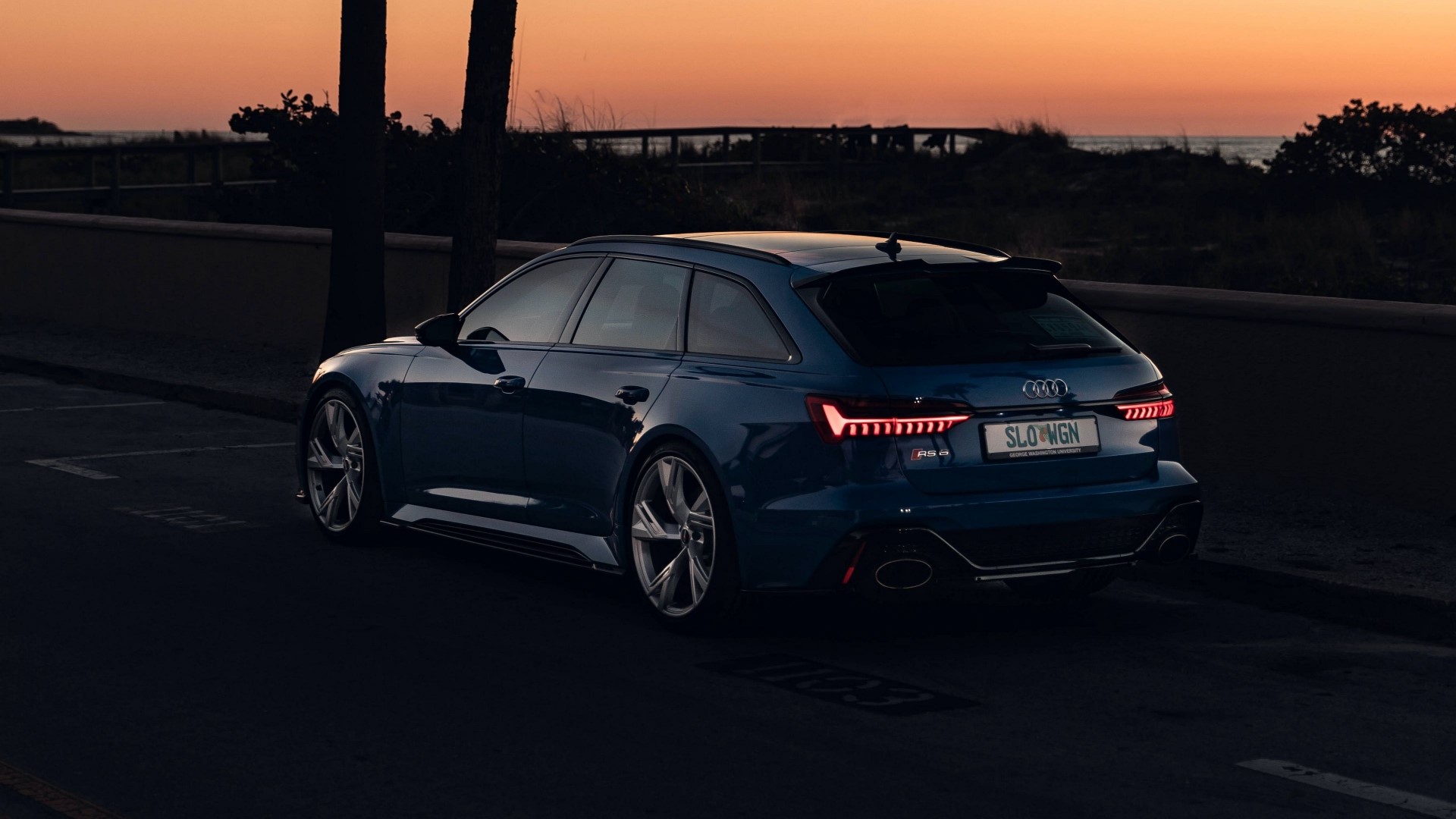 Blue Audi RS6 Avant parked by the sea at sunset HD Wallpaper