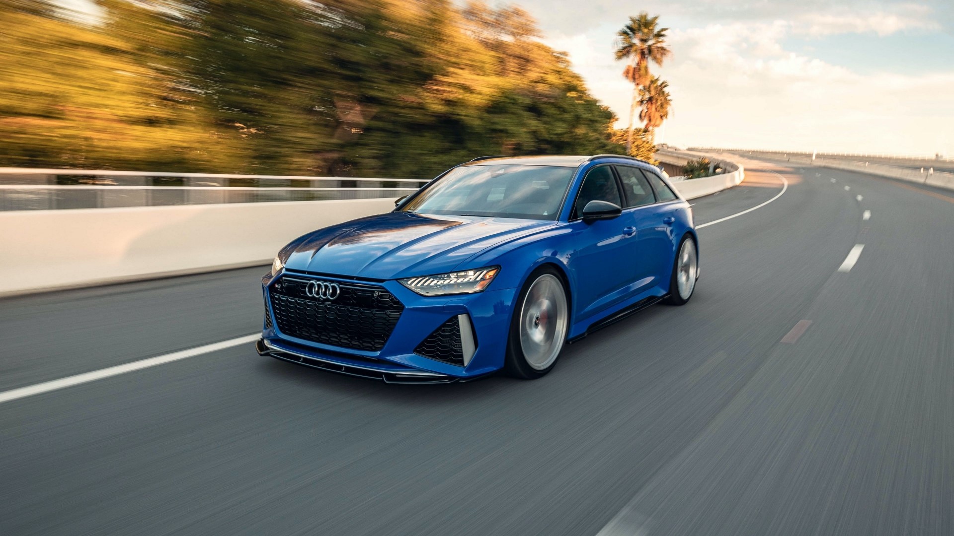 Blue Audi RS6 Avant driving on a highway HD Wallpaper