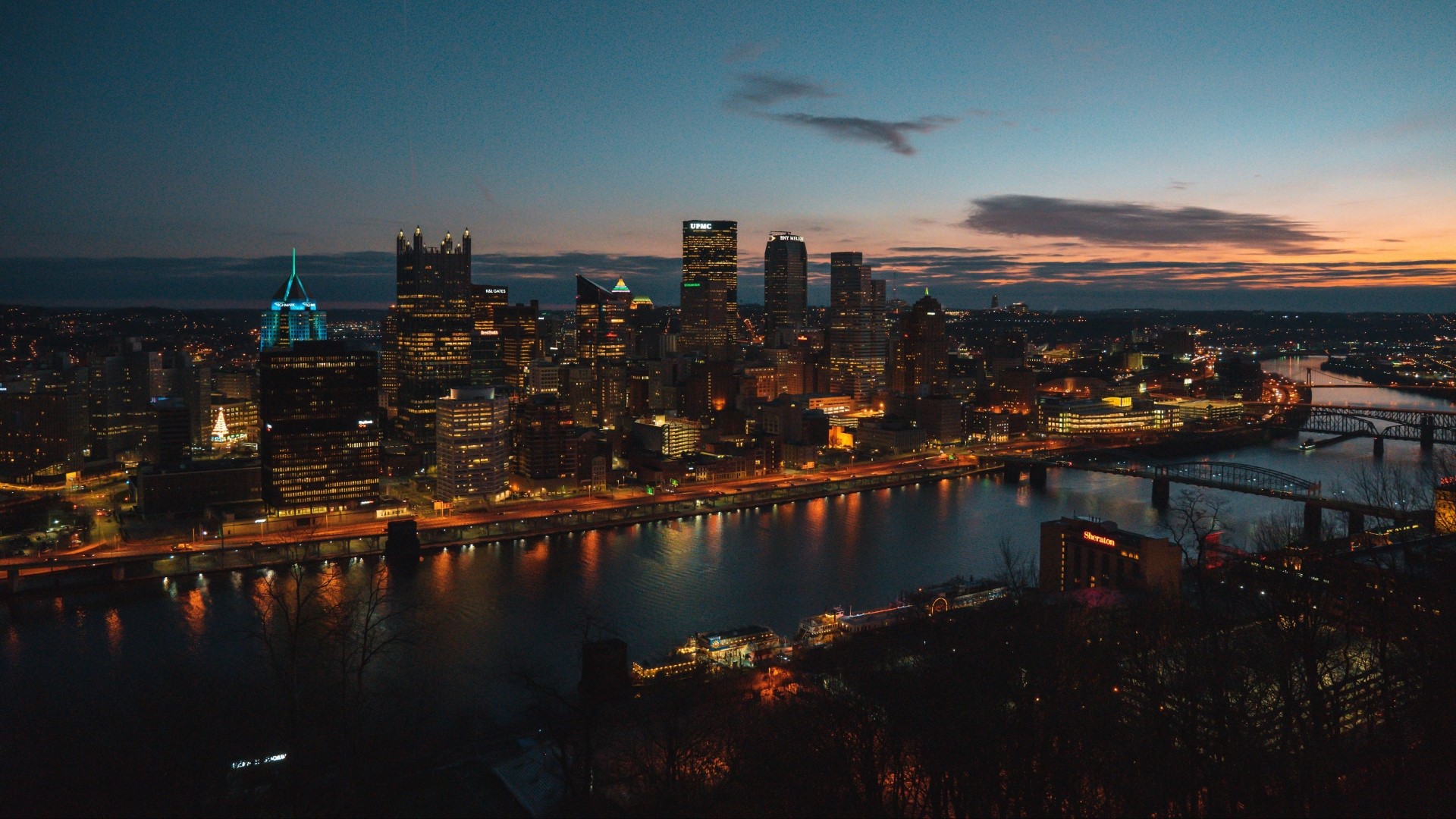 Pittsburgh skyline at dusk with rivers and bridges HD Wallpaper
