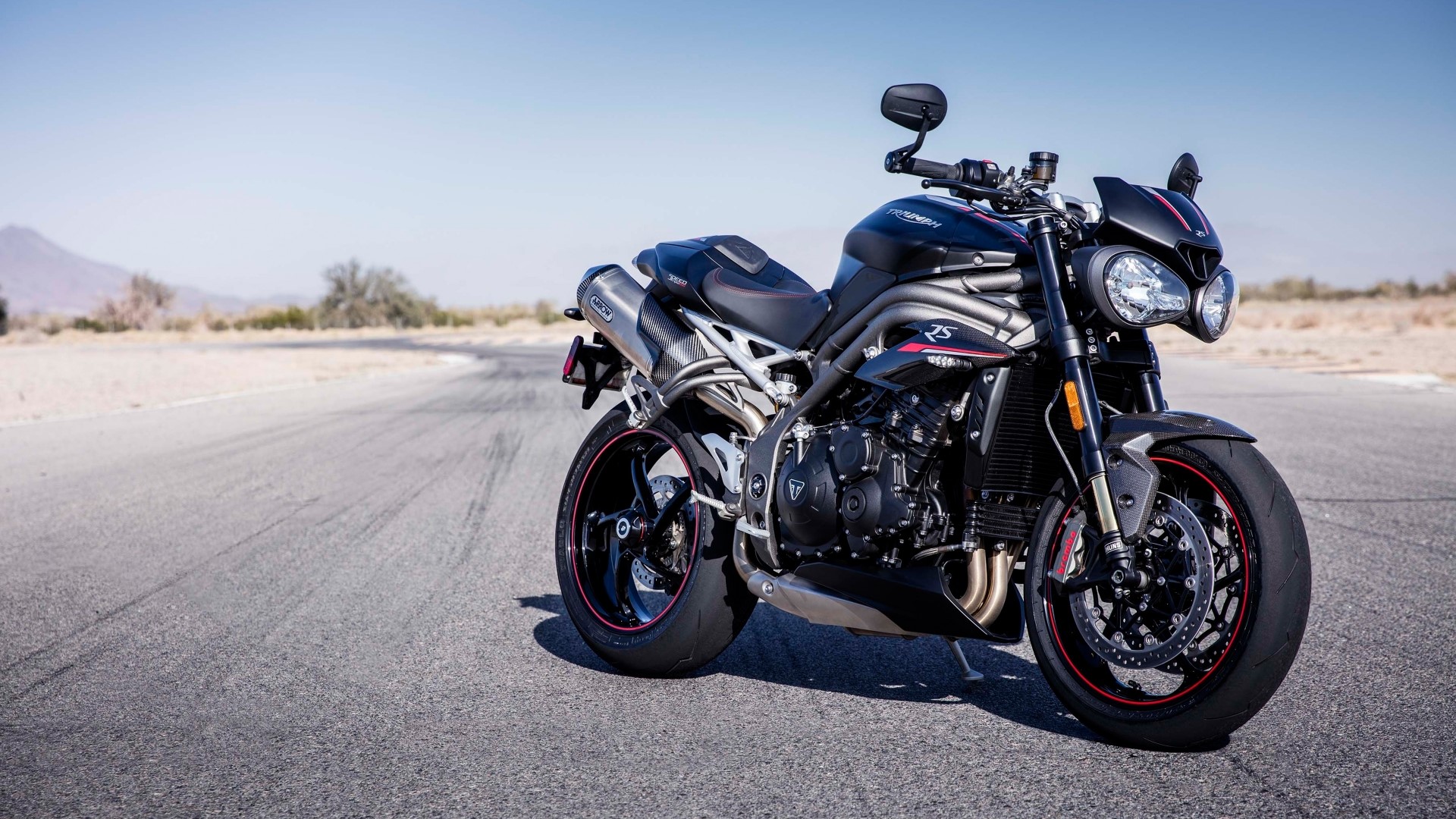 Triumph Speed Triple RS motorcycle on a road HD Wallpaper
