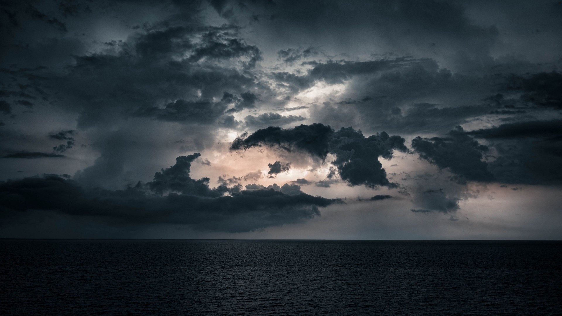 Dark Stormy Clouds Over the Ocean at Dusk HD Wallpaper