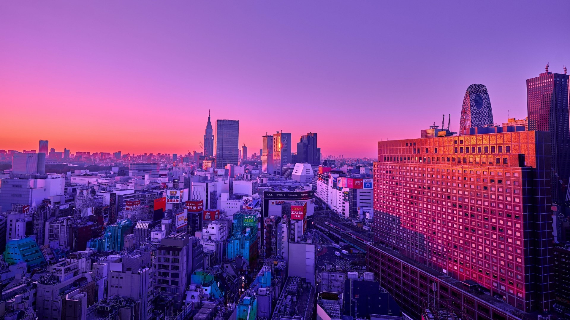 Cityscape at Dusk with Purple and Pink Sky HD Wallpaper