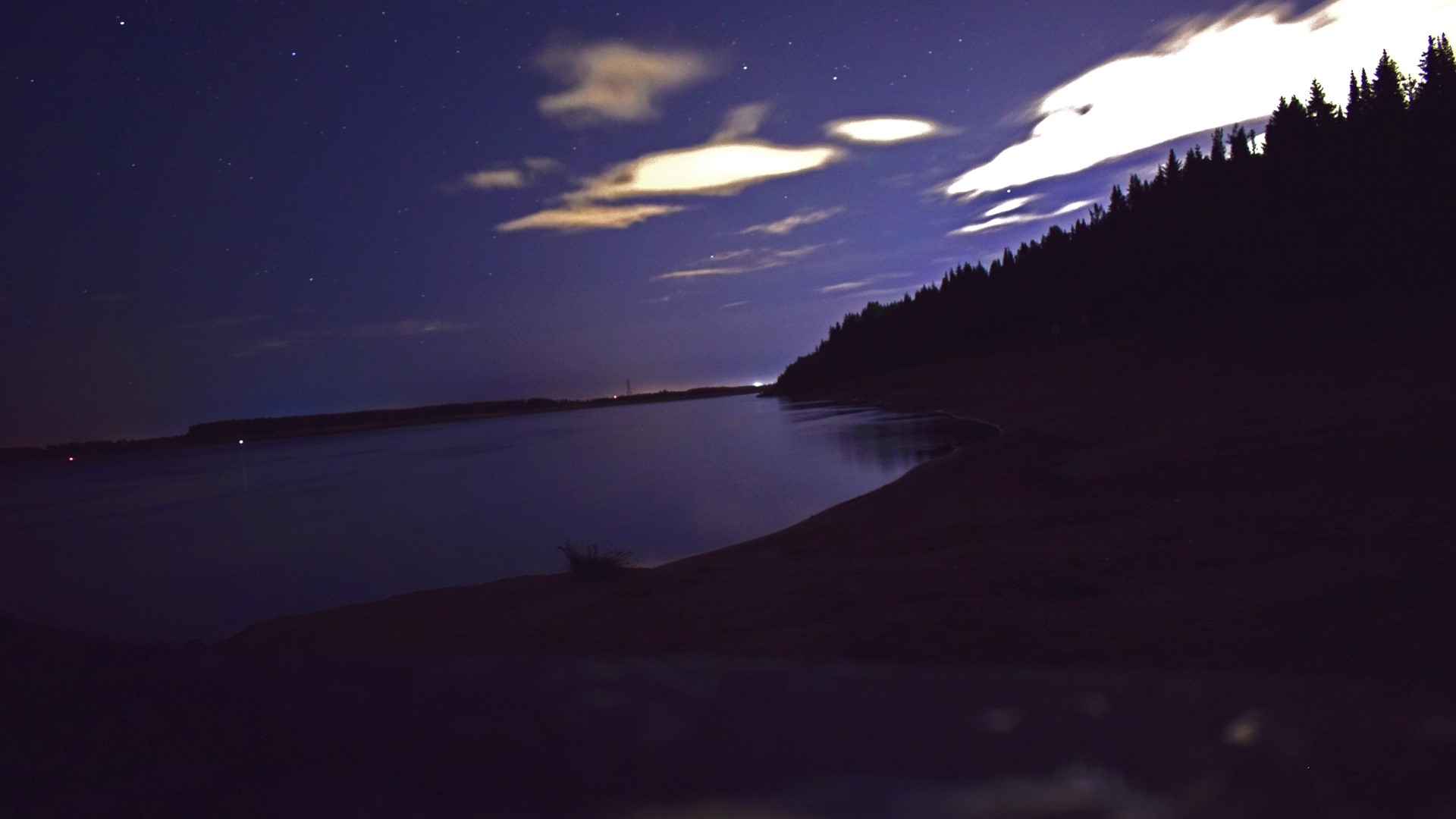 Night sky over a river and forest HD Wallpaper