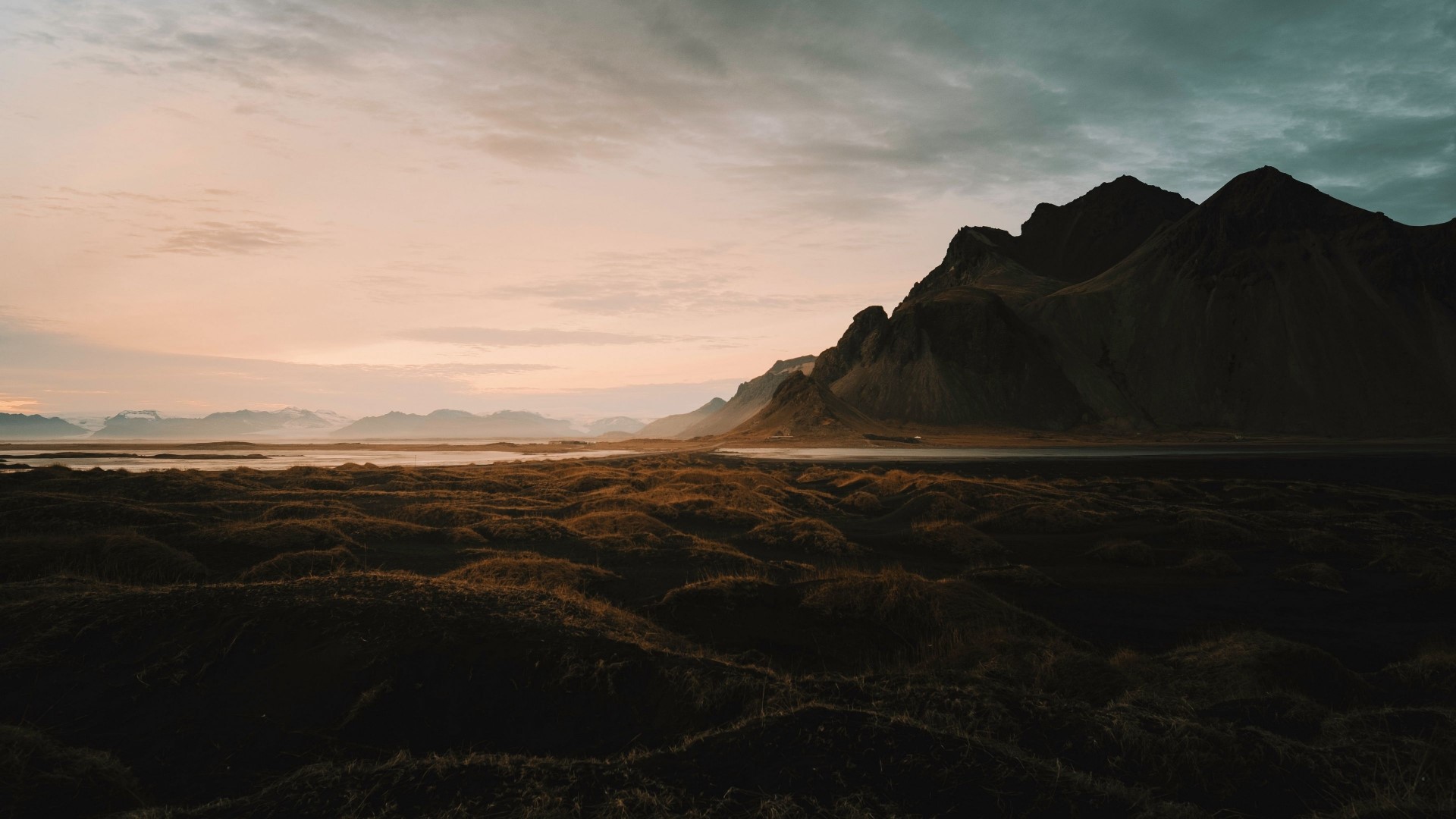 Mountain landscape at sunset with foreground grass HD Wallpaper