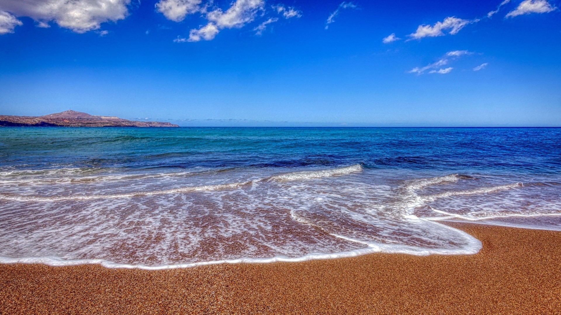 Beach with Waves and Distant Hill HD Wallpaper