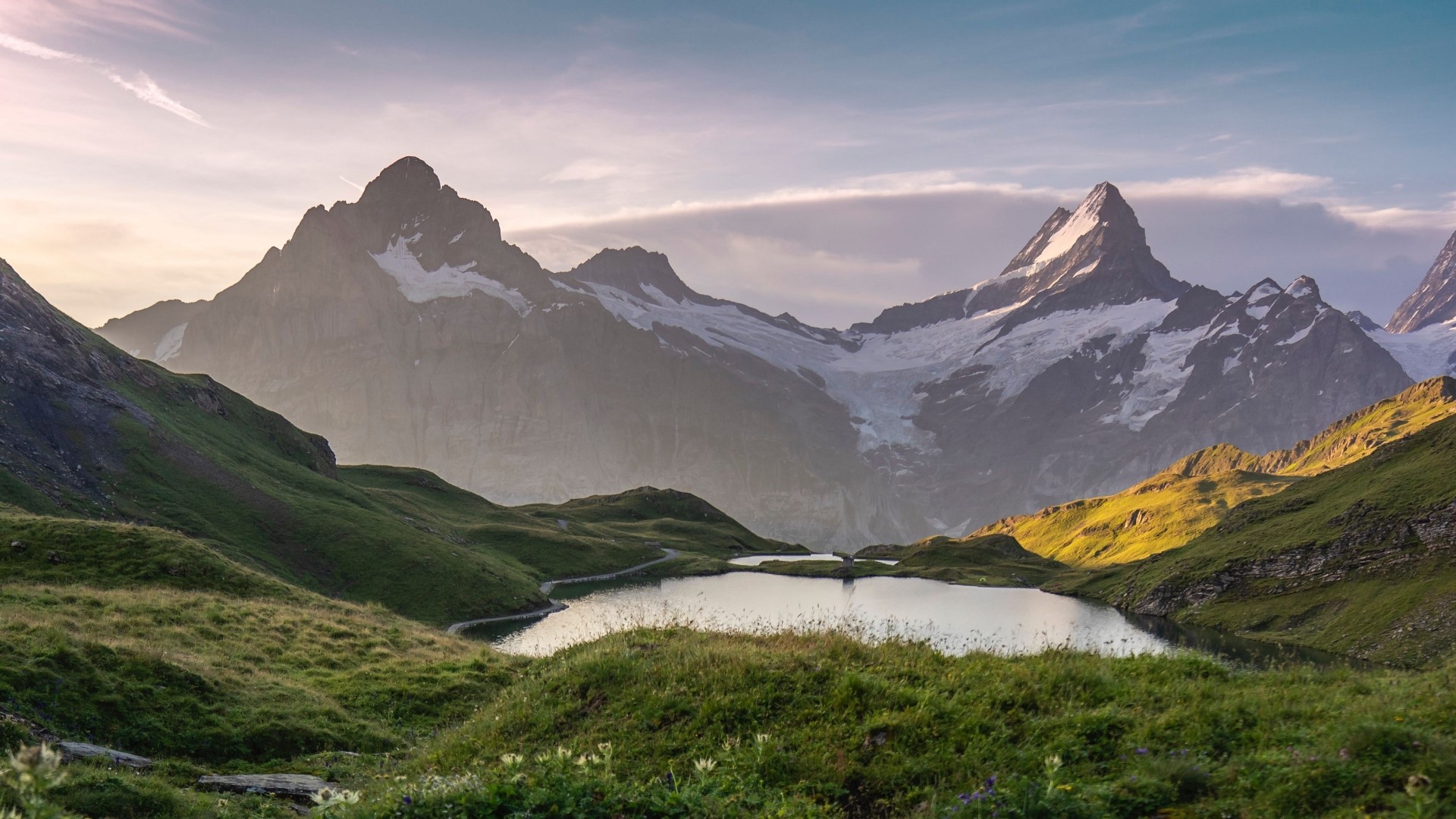 Mountain peaks and a lake at sunrise HD Wallpaper