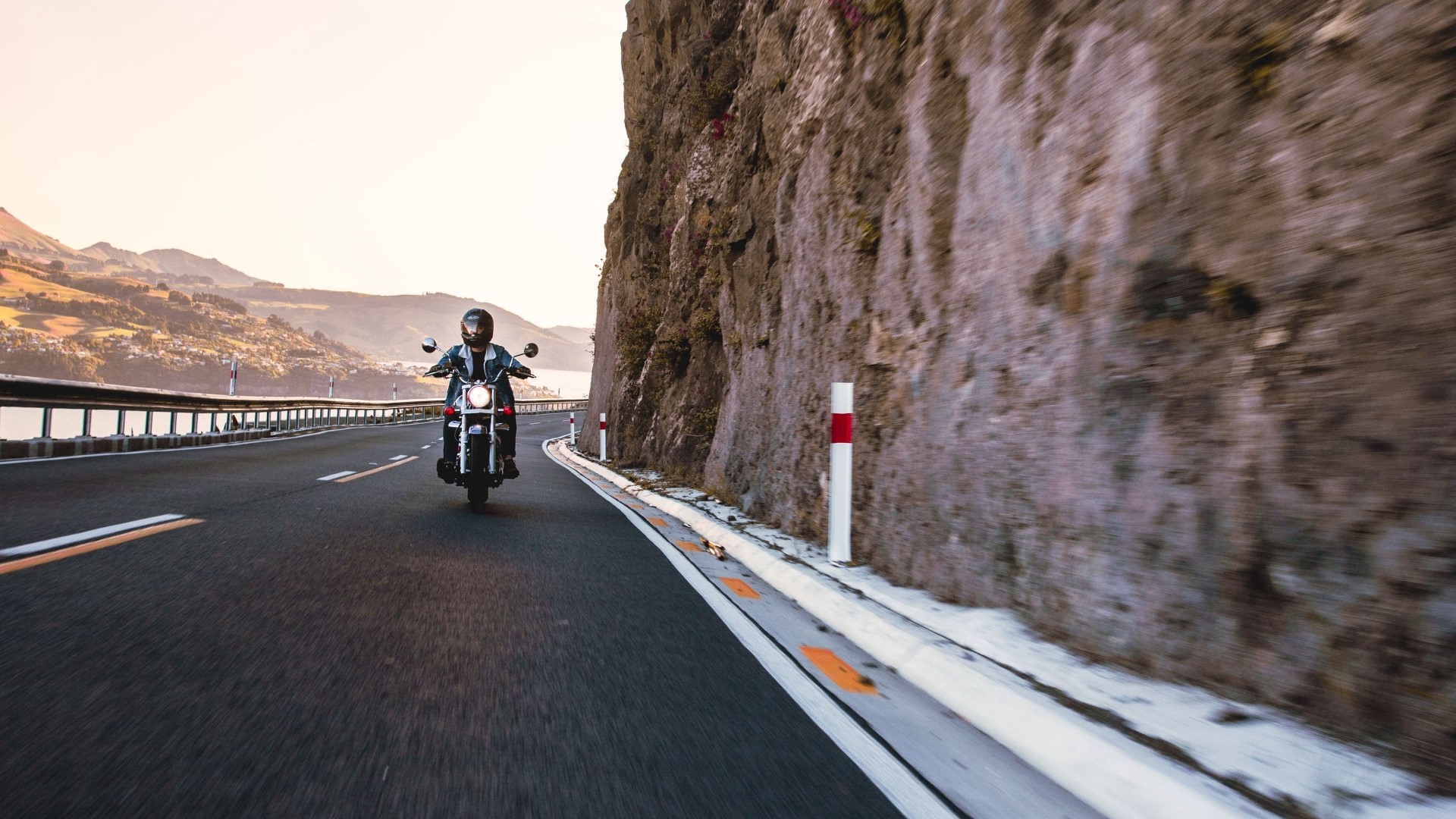 Motorcyclist on a scenic road HD Wallpaper