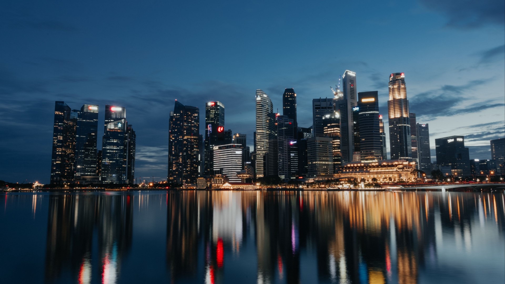 Night city skyline with water reflection HD Wallpaper