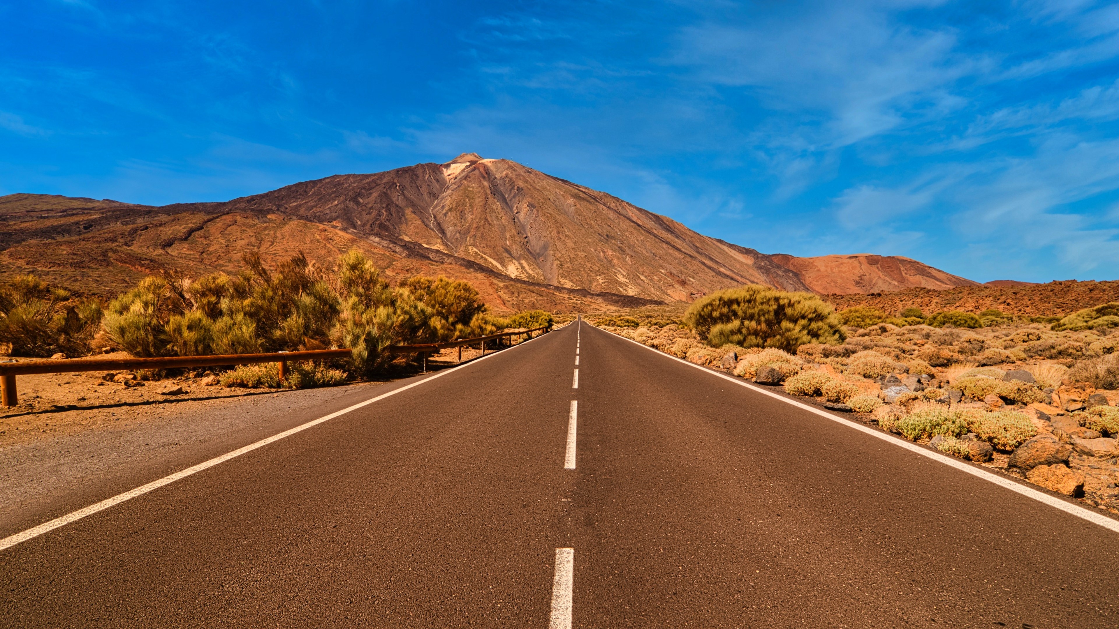 4K Road leading to a Mountain HD Wallpaper