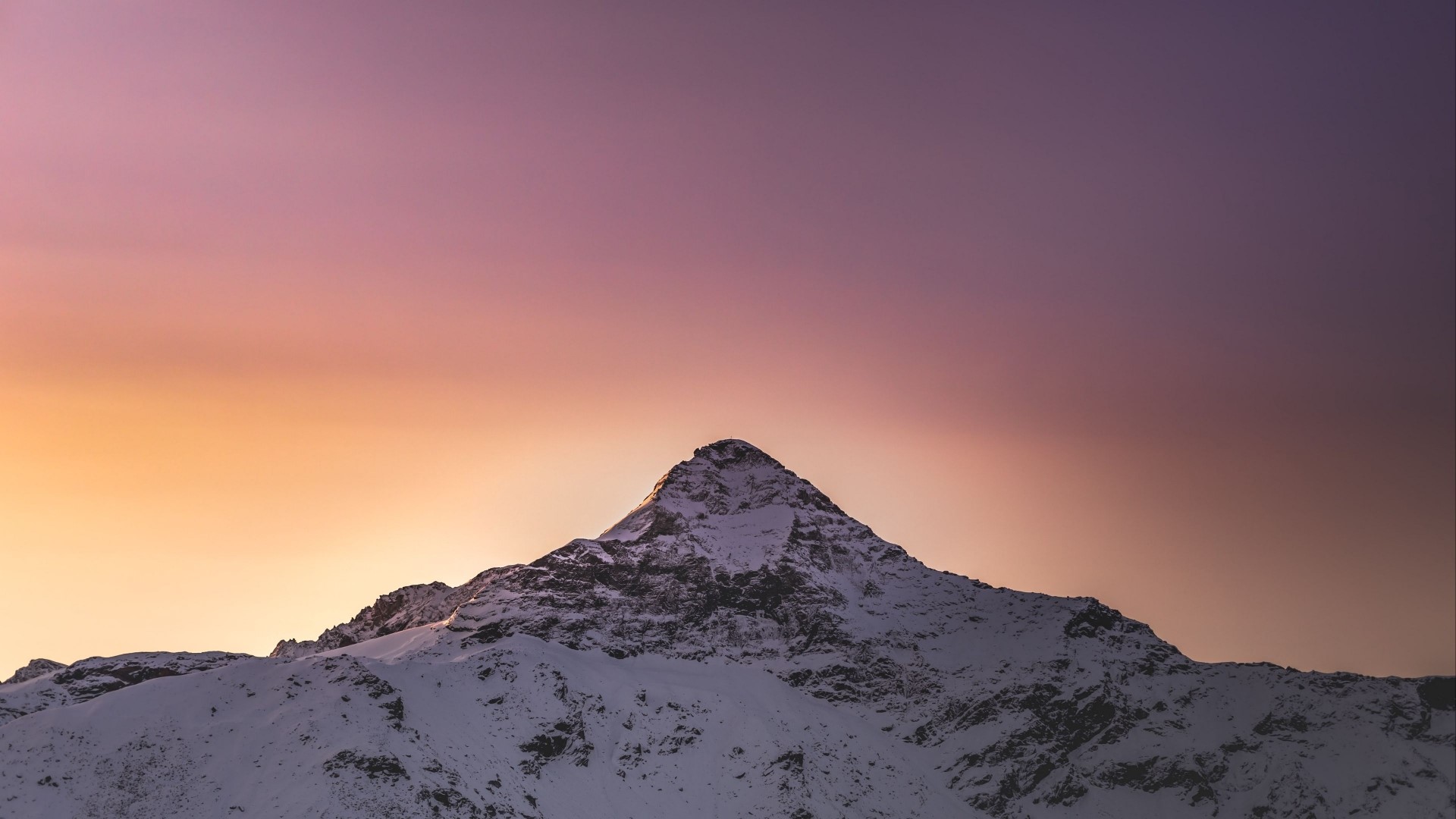 Snowy mountain peak at sunset HD Wallpaper