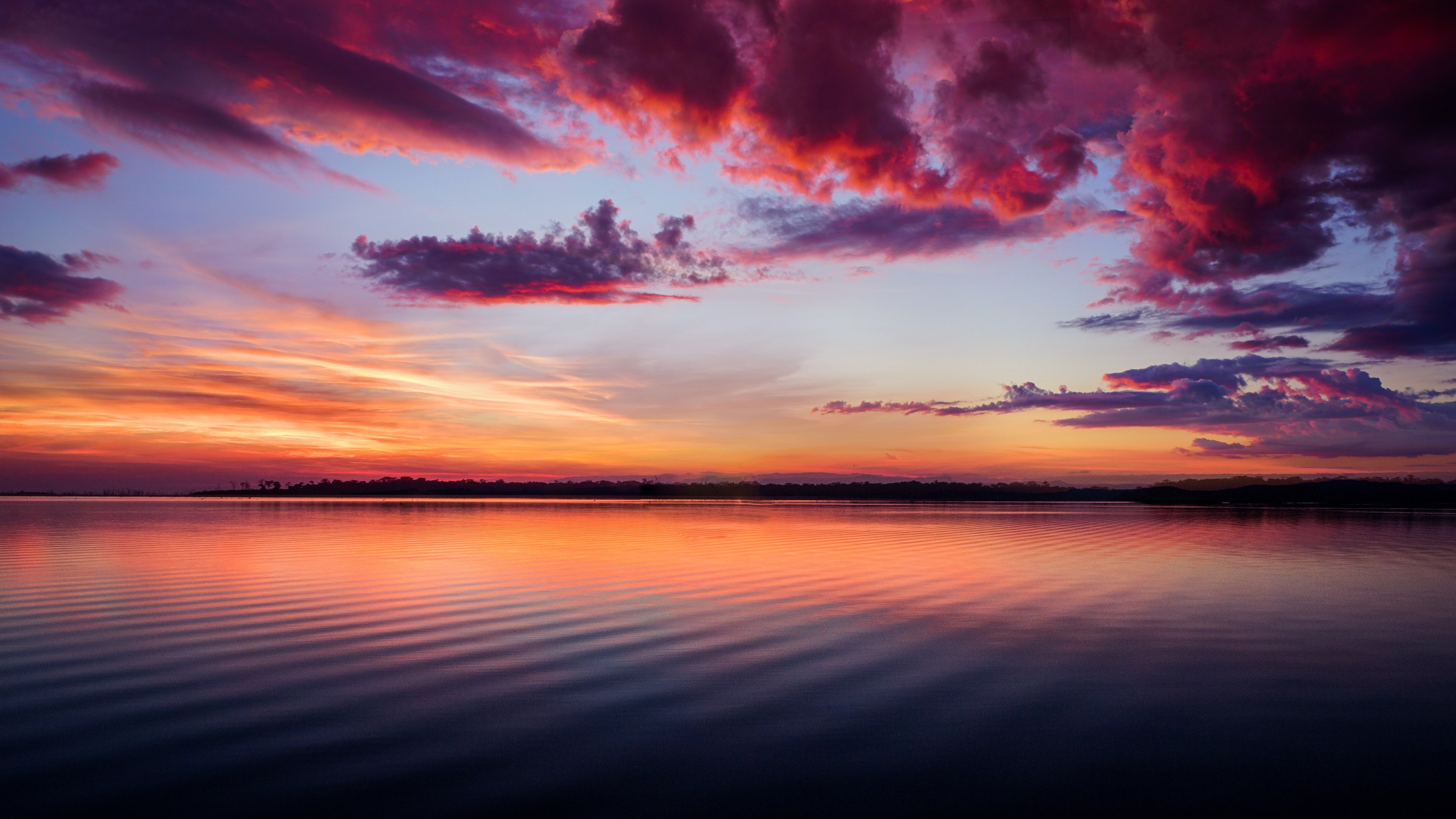 4K Sunset Over Calm Water HD Wallpaper
