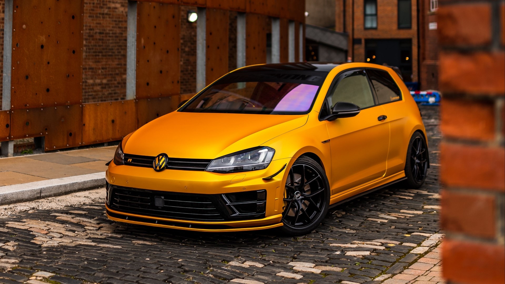 Orange Volkswagen Golf R on Cobblestone Street HD Wallpaper