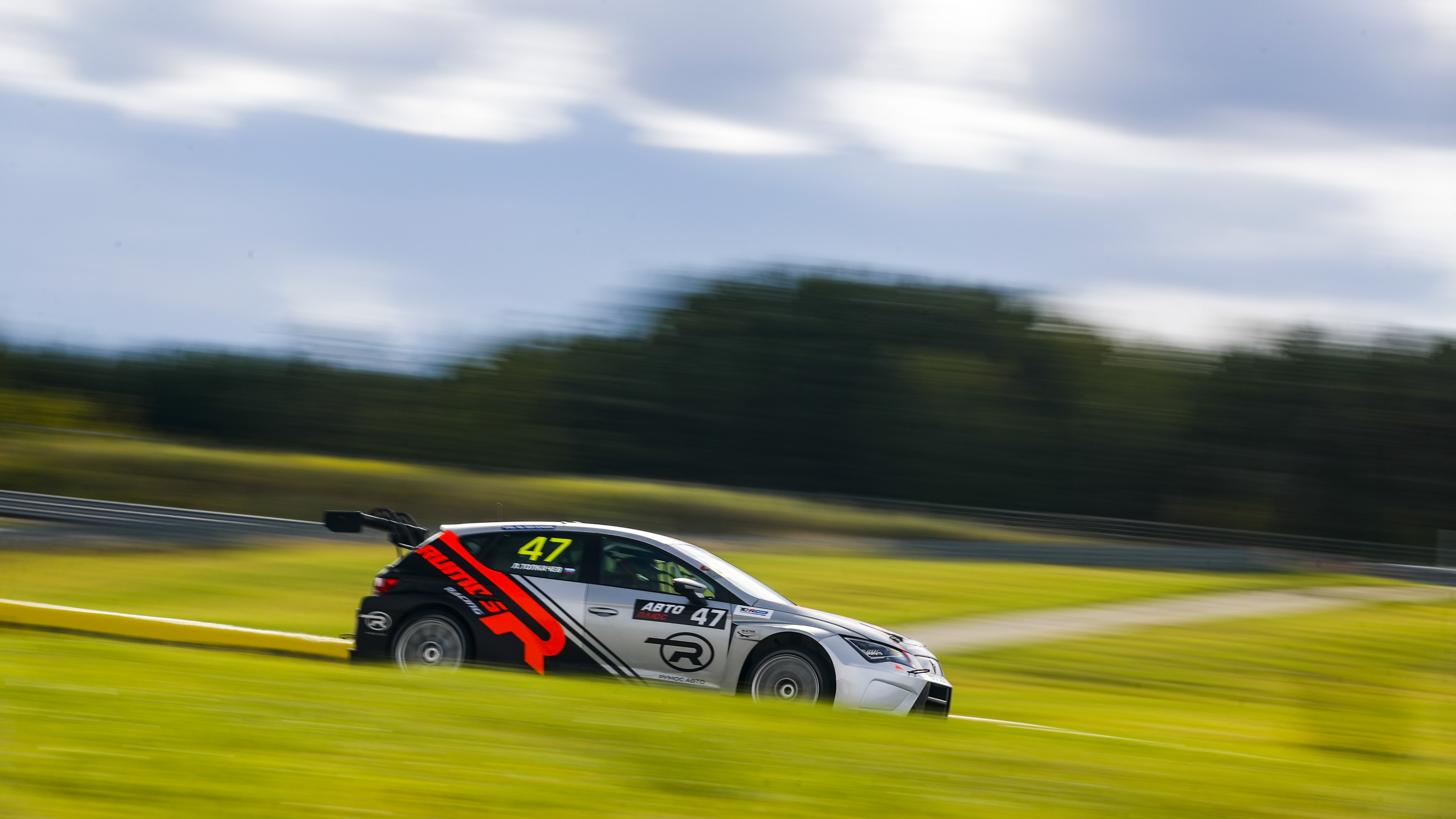 Race car with number 47 on a track HD Wallpaper