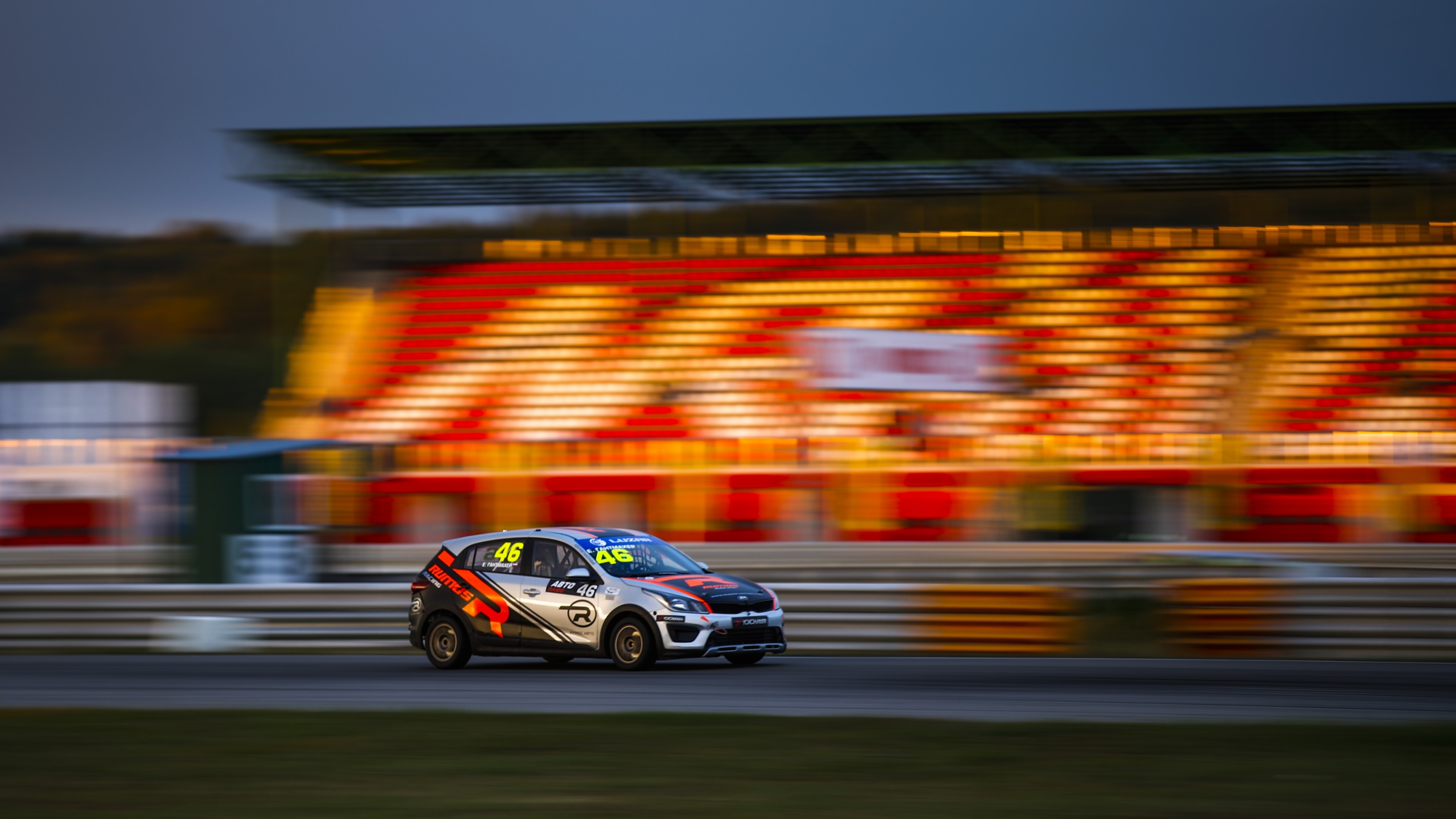 Race car with number 46 on a track HD Wallpaper
