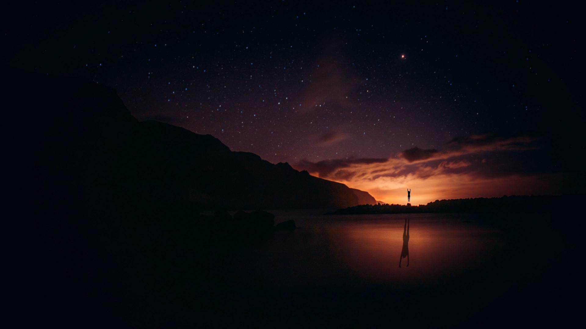 Person doing a handstand by a lake at sunset HD Wallpaper