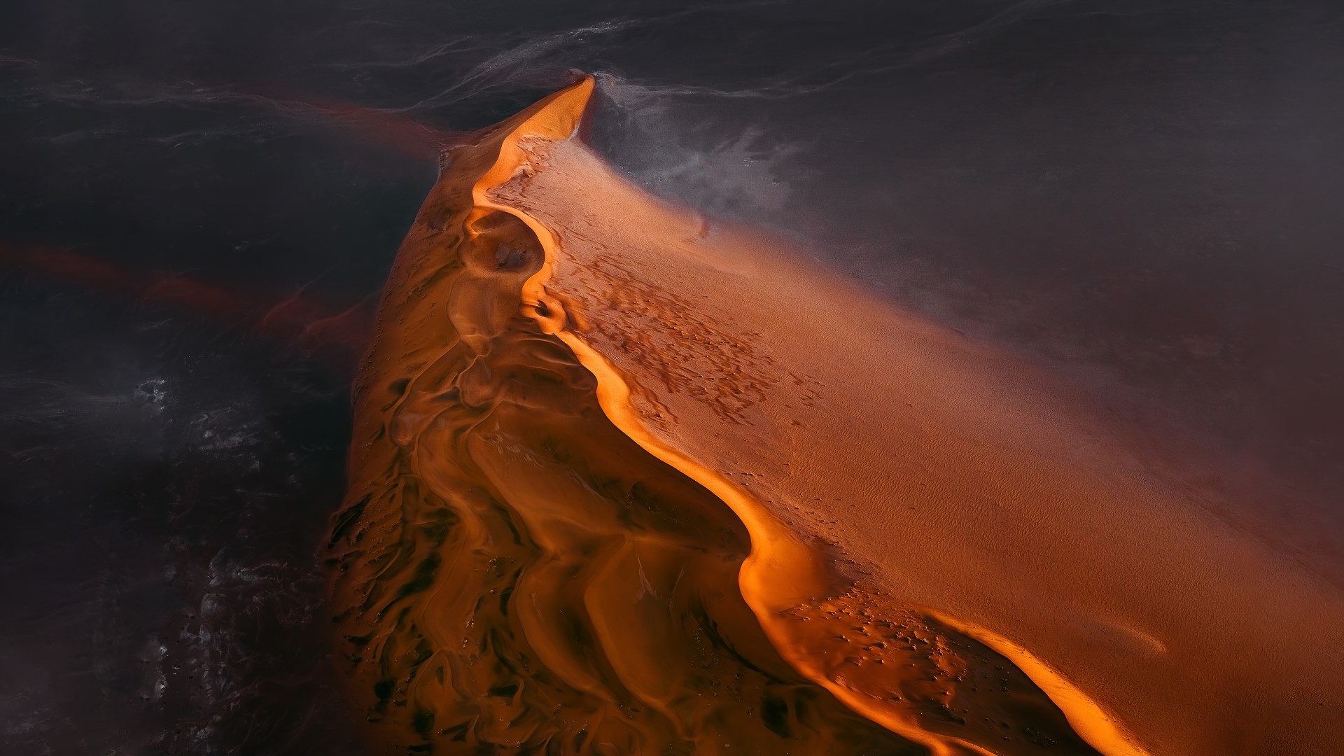 Aerial view of a desert dune with water HD Wallpaper