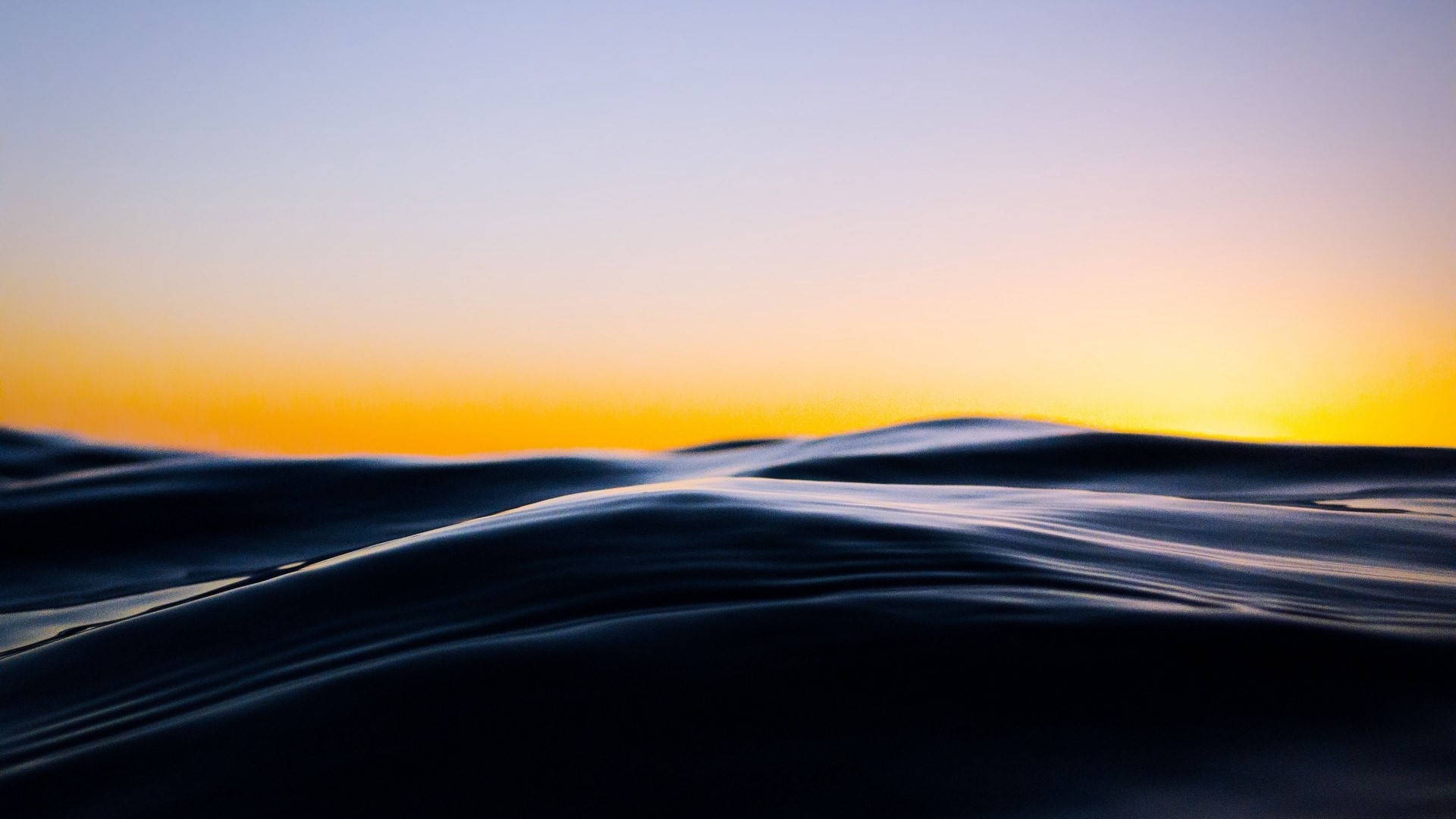Ocean waves at sunset HD Wallpaper