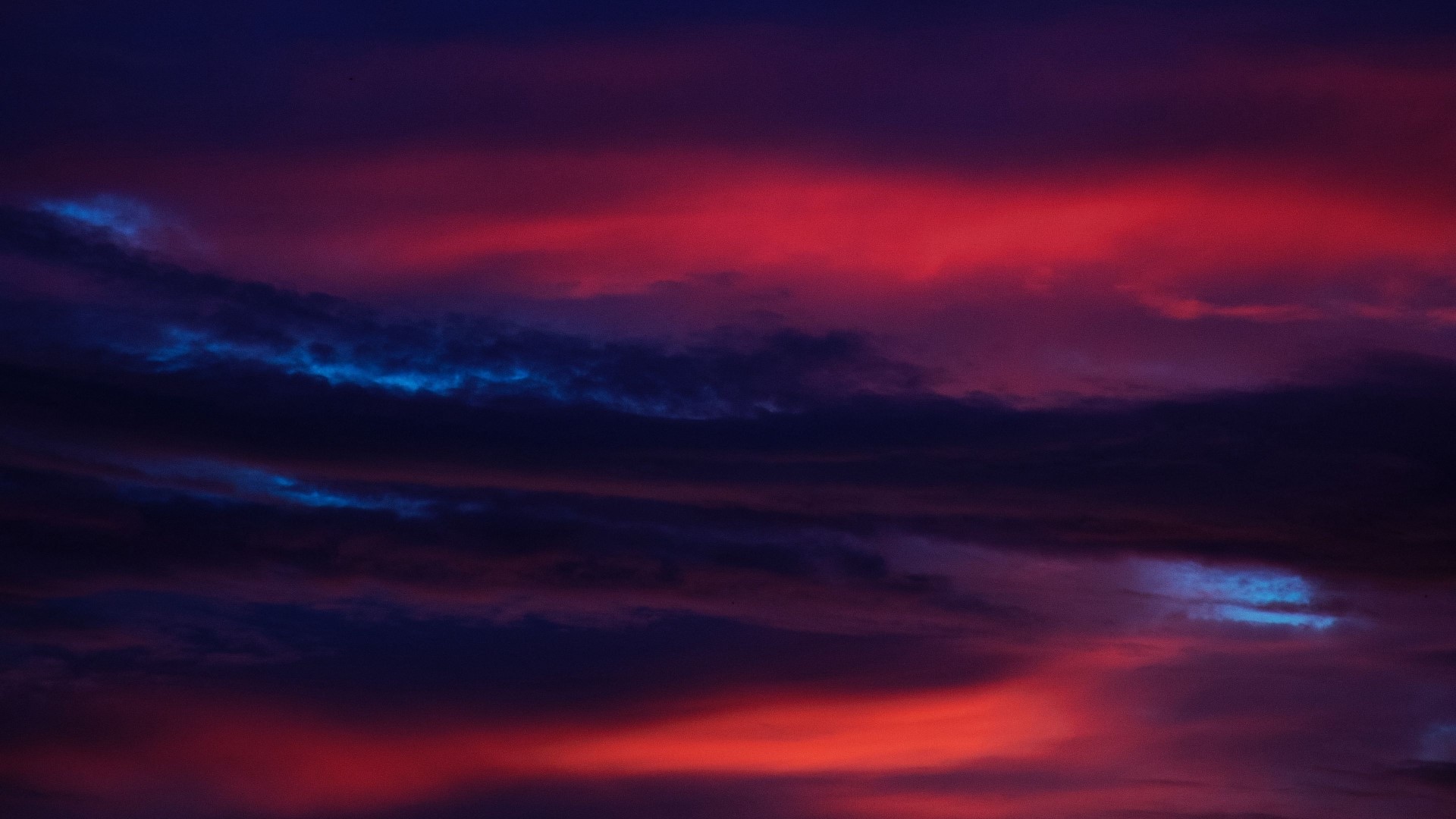 Dramatic sunset clouds with red and blue hues HD Wallpaper